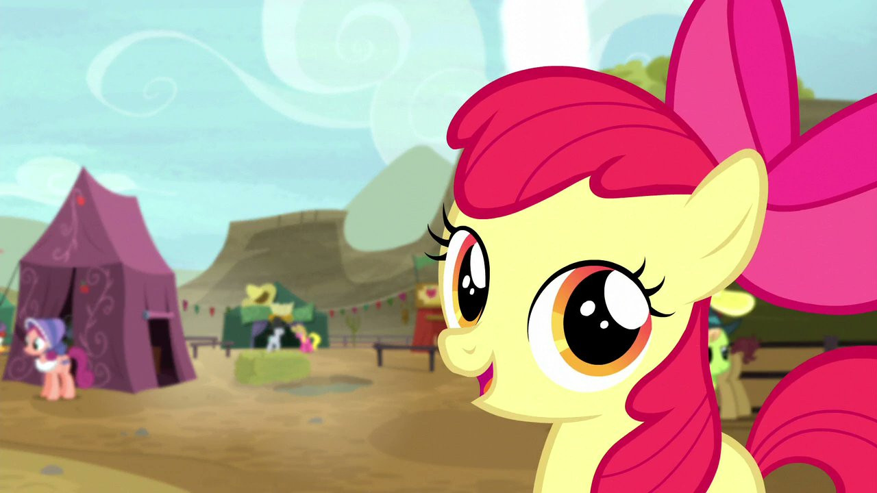 Applebloom smiling happily at the camera. There is no visual indication of her bloodlust, but we all know it's there.