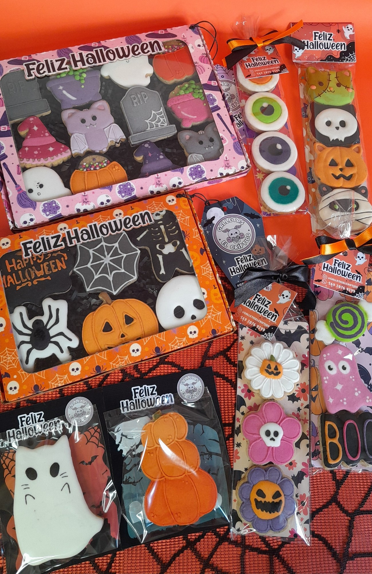 An assortment of halloween cookies in different packaging.