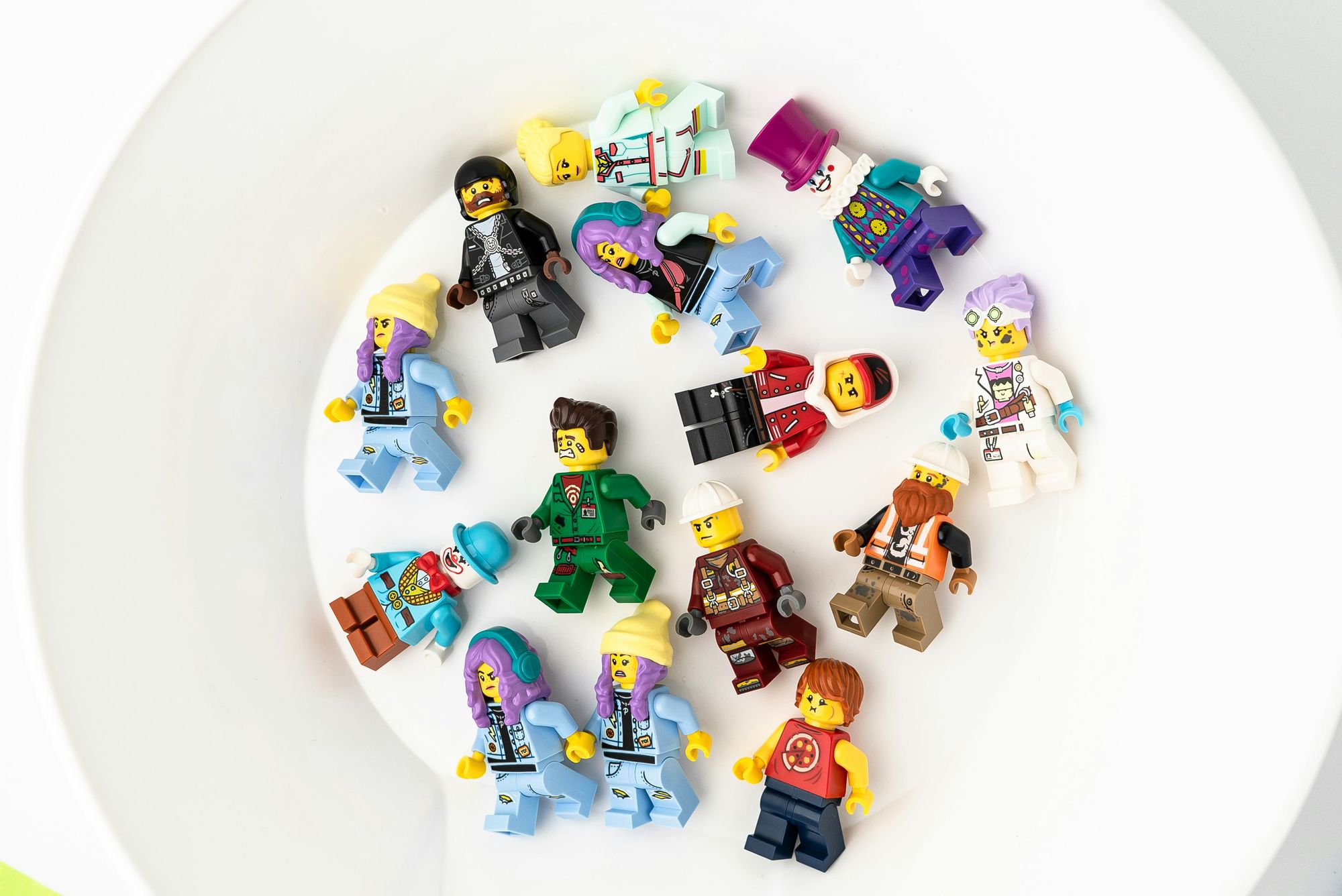 A photo of a group of lego minifigs placed in a spiral. 