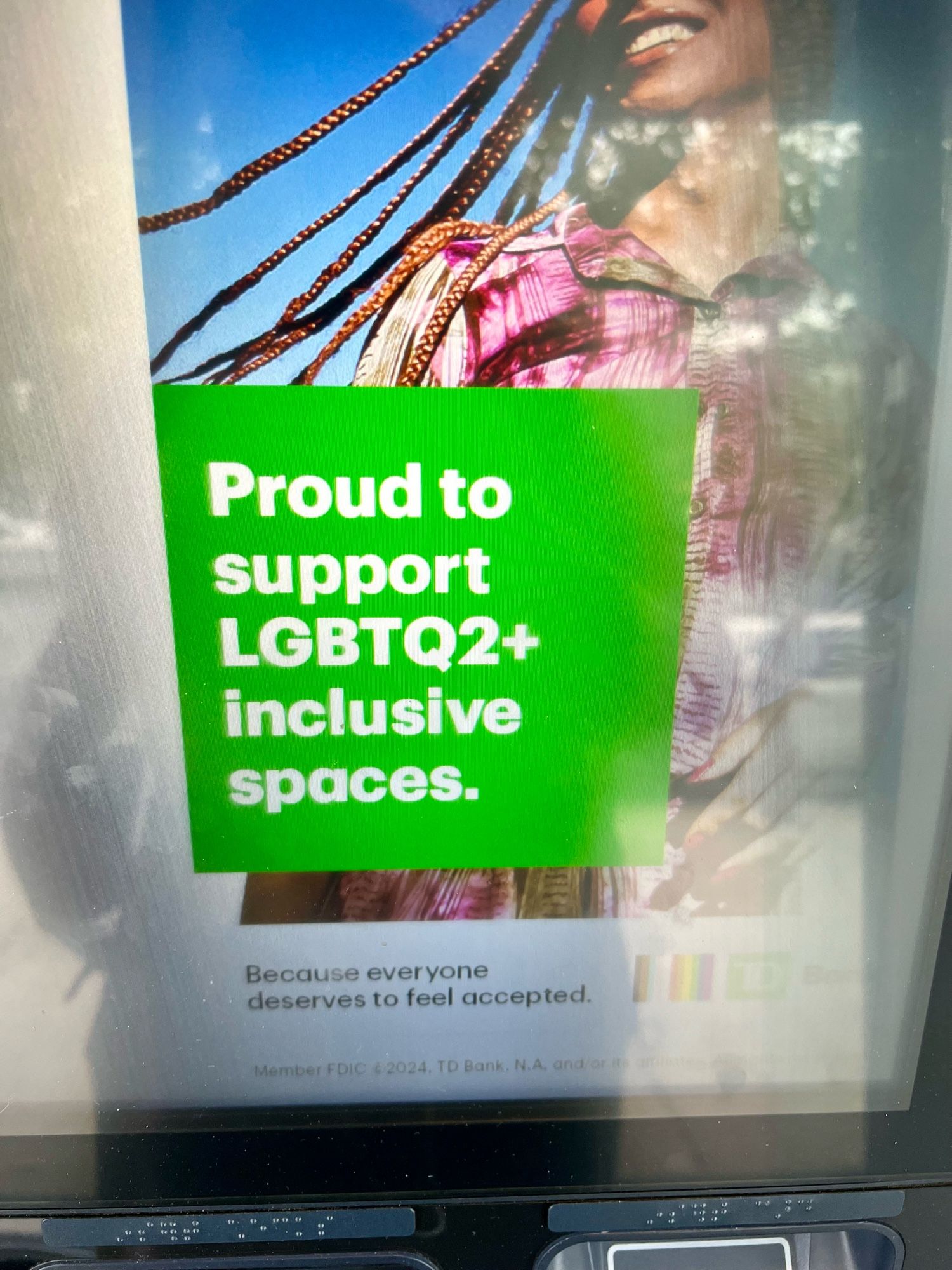 bank ad that says “Proud to support LGBTQ2+ inclusive spaces”