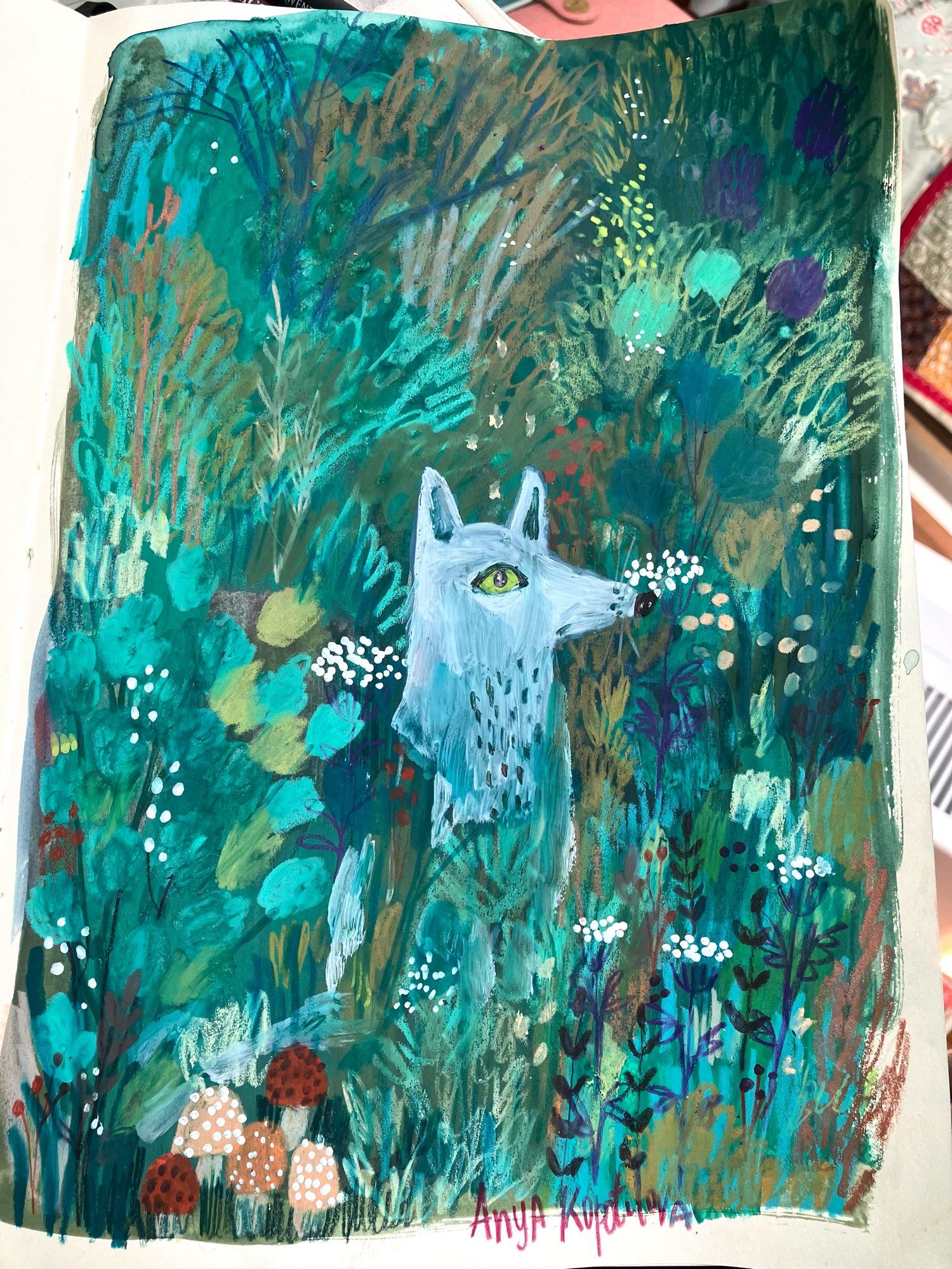 Sketchbook page drawing of a light gray wolf sitting in textured greenery. Mixed media kidlit illustration