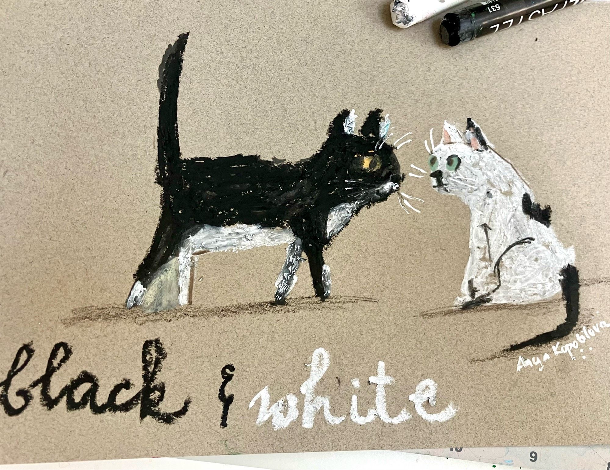 Black and white kidlit sketch on tan paper, oil pastels depicting a black kitten walking up to a white kitten who is sitting down