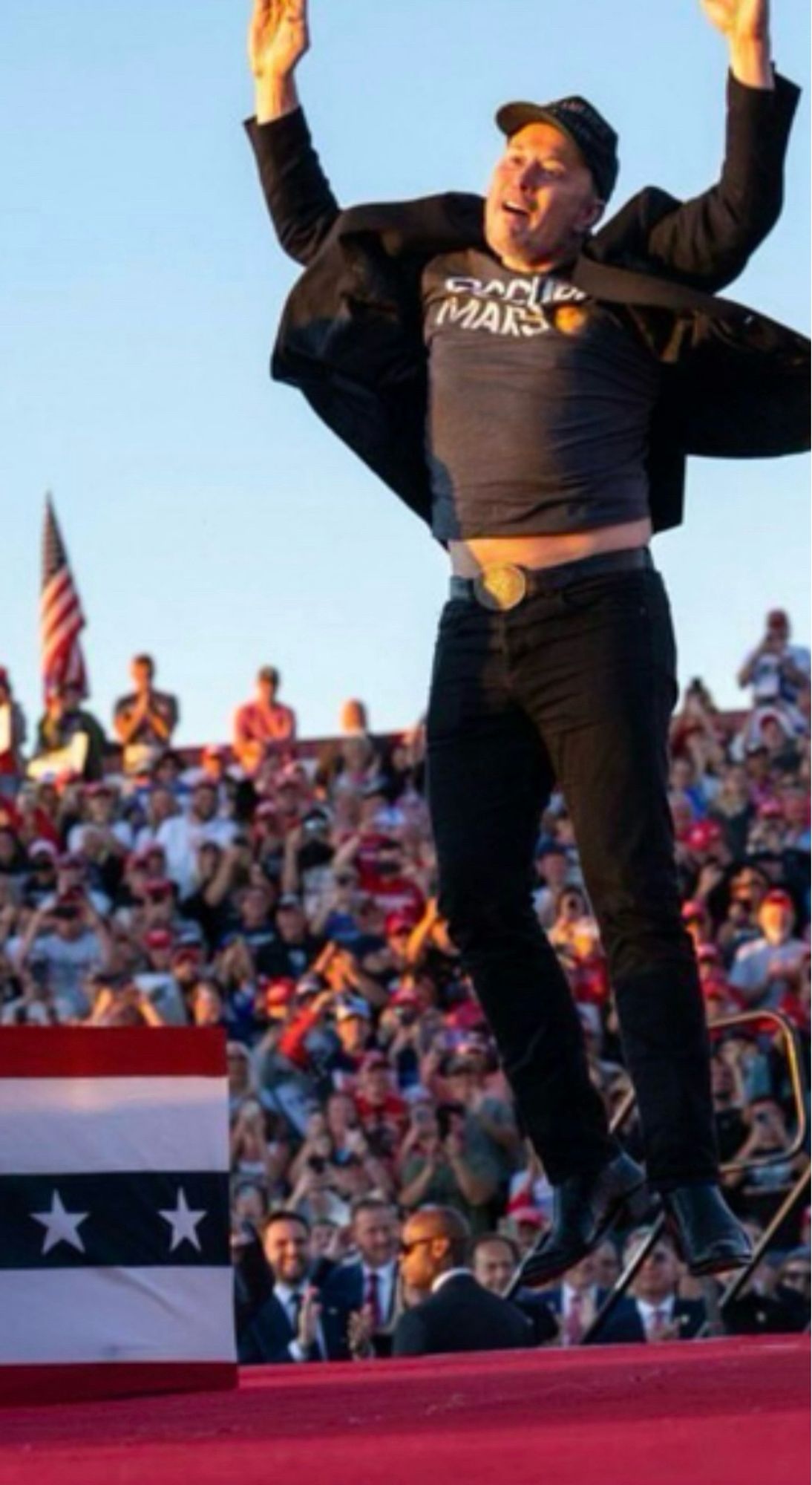 cropped zoom of the grotesque elon jumping pic