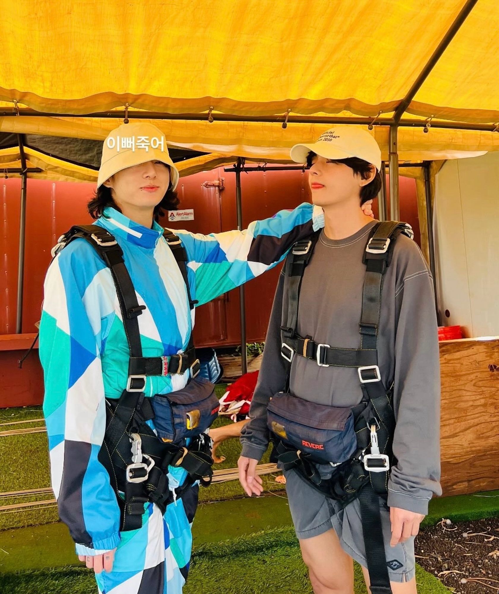 Jungkook and taehyung in what looks like skydiving gear