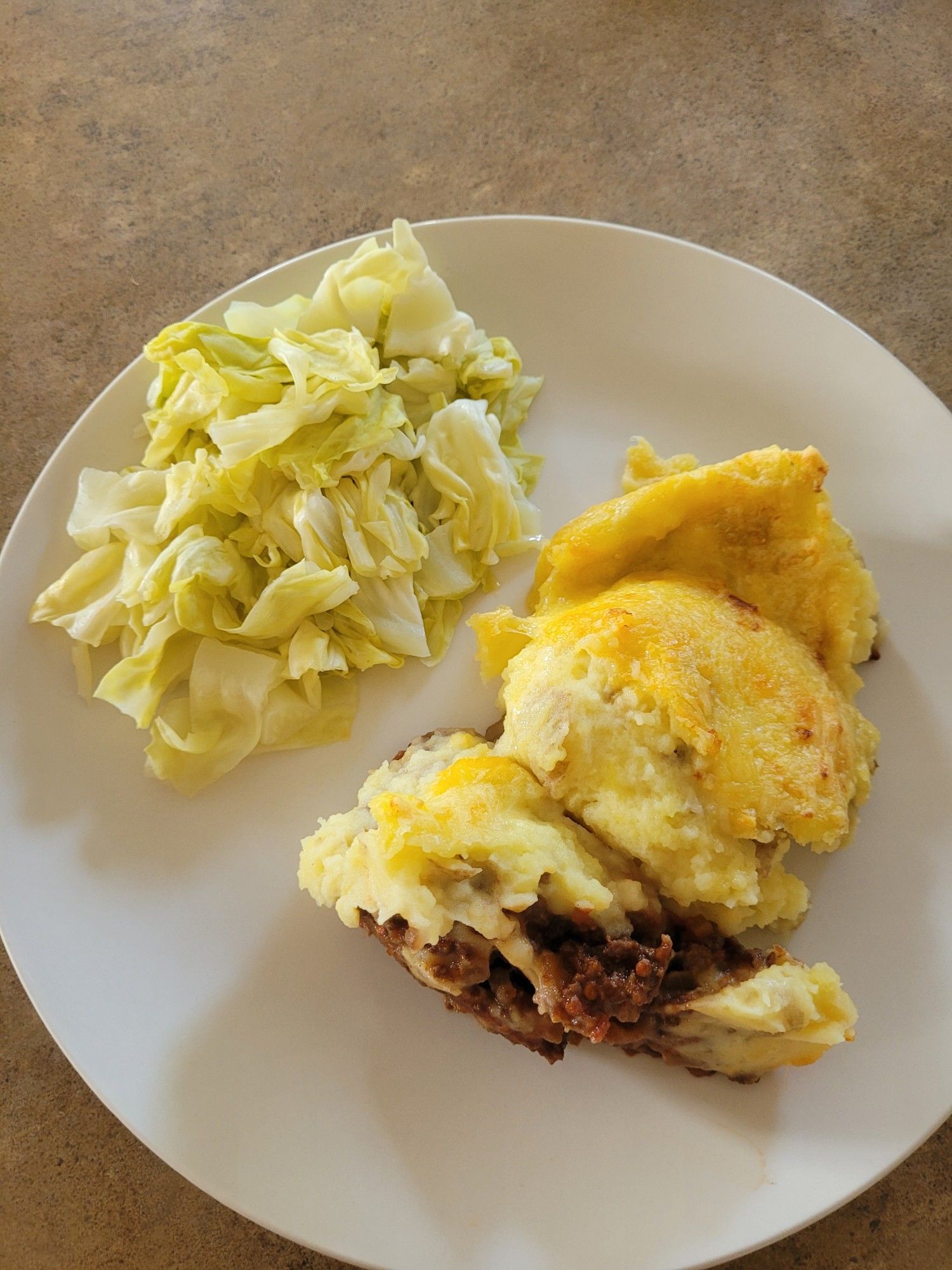 Dinner as described served on a round white plate