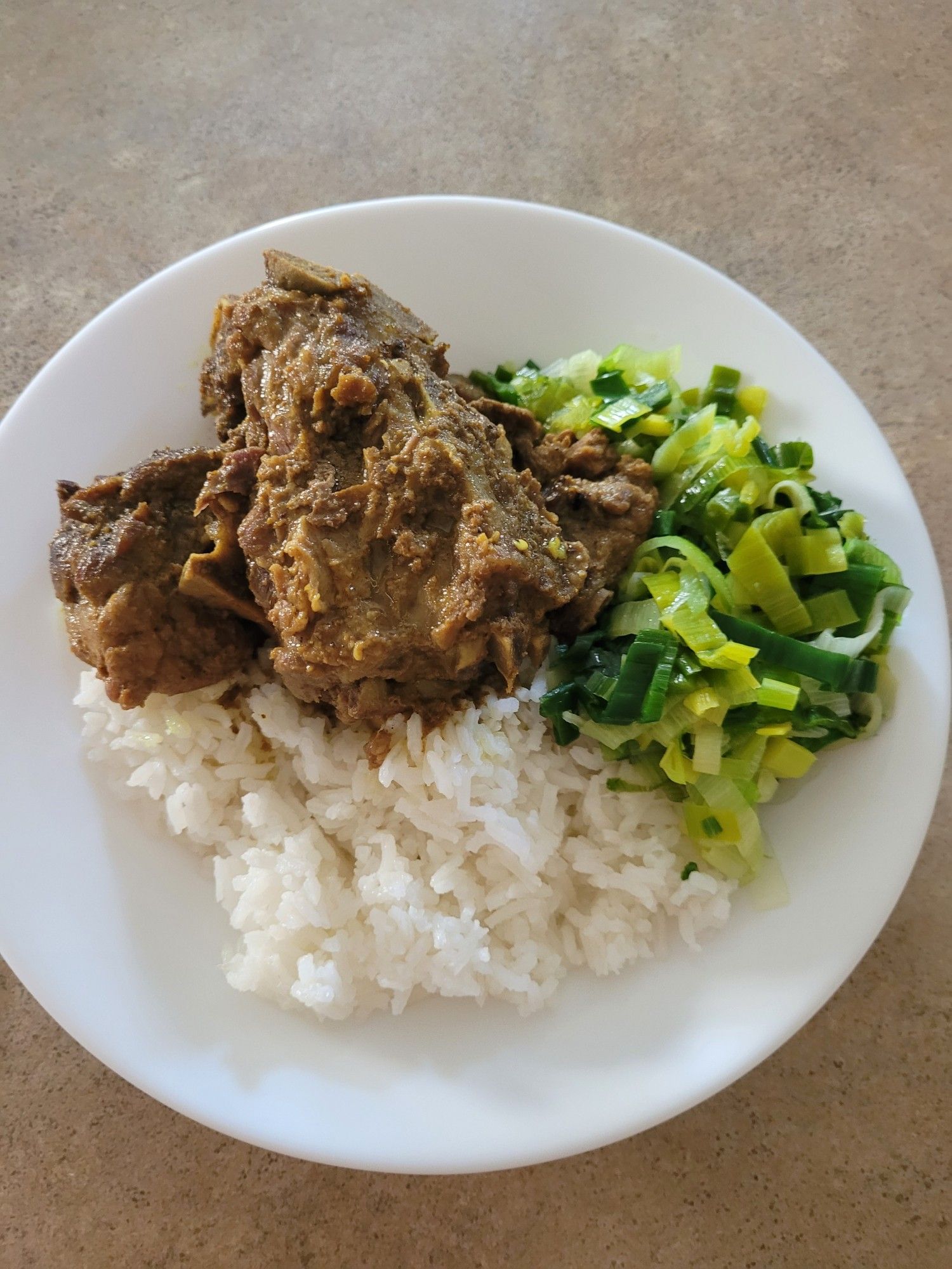 Dinner as described served on a round white soup plate.