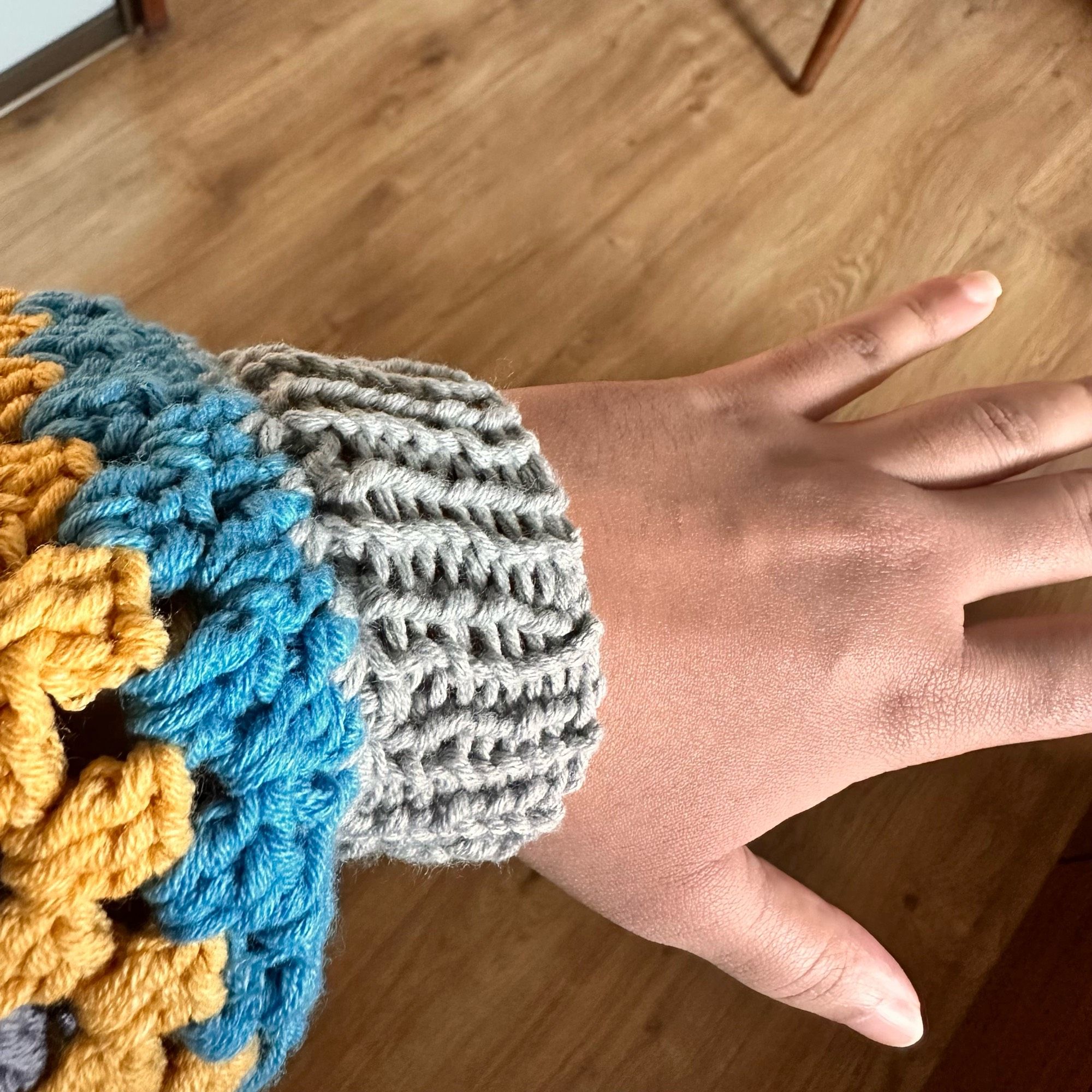 Showing off the finished cuff after wearing the sleeve