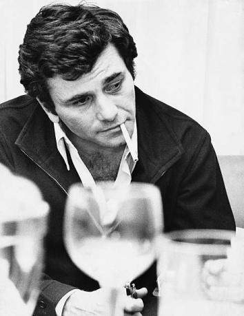 Peter Falk candidly photographed behind a bunch of tableware/glasses, casually smoking a cigarette because he made smoking cool, and anyone who says differently has to live with being wrong. And yes you know his shirt is half undone