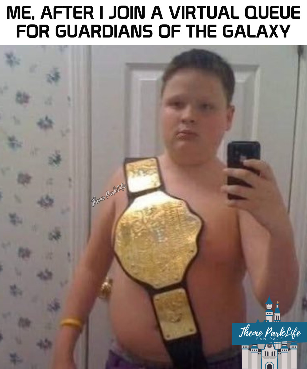 Child looking proud while taking a selfie in the mirror while wearing a professional wrestling championship belt.