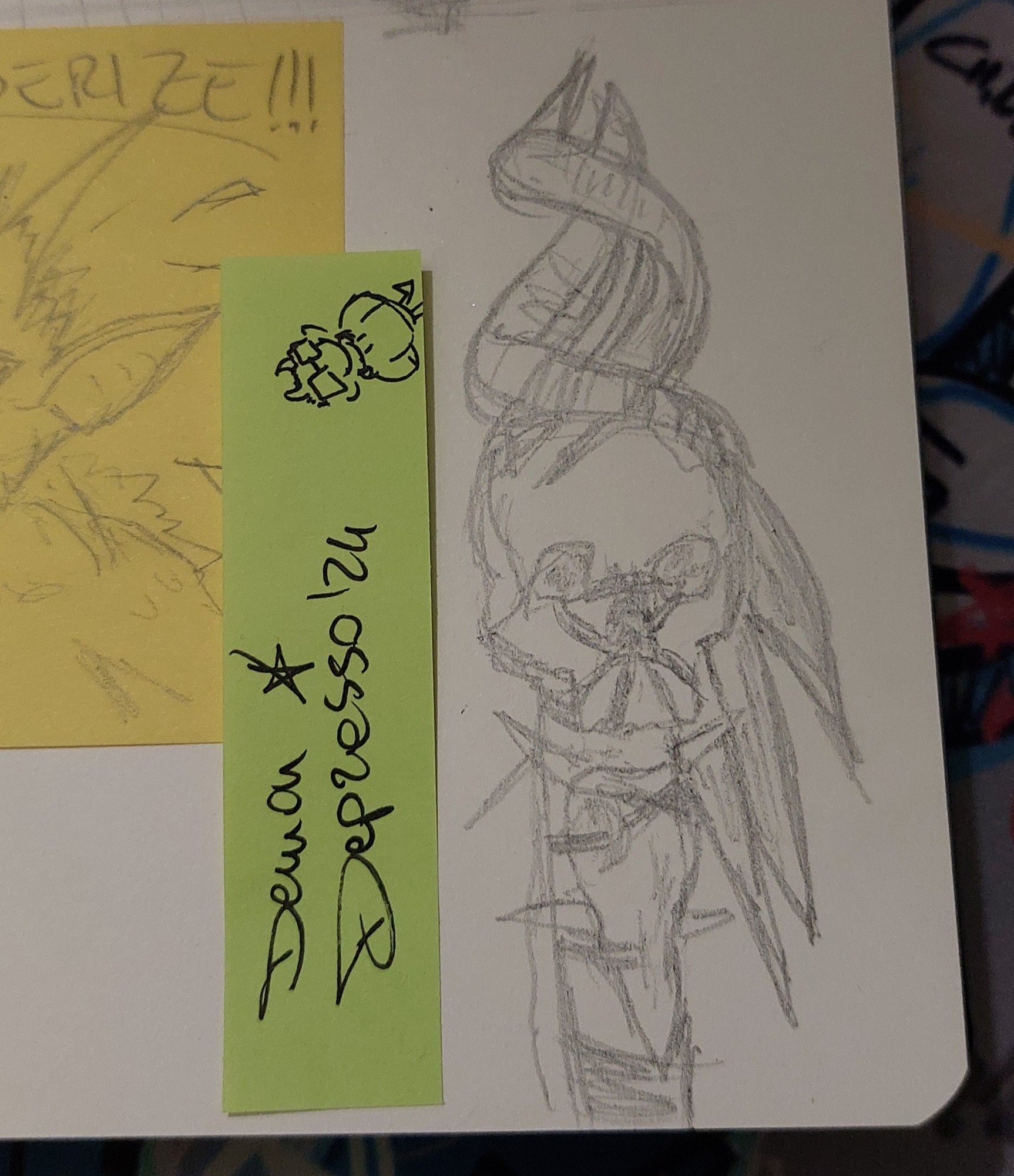 Photo of the bottom right side of an off-white sketchbook page. There's a messy pencil sketch of the "staff of crones" from BG3. Next to it on the left a small light green sticky note with my sona doodled in a corner and the signature "Demon Depresso '24". On the farther left a yellow sticky note with another pencil doodle peeks in the photo.