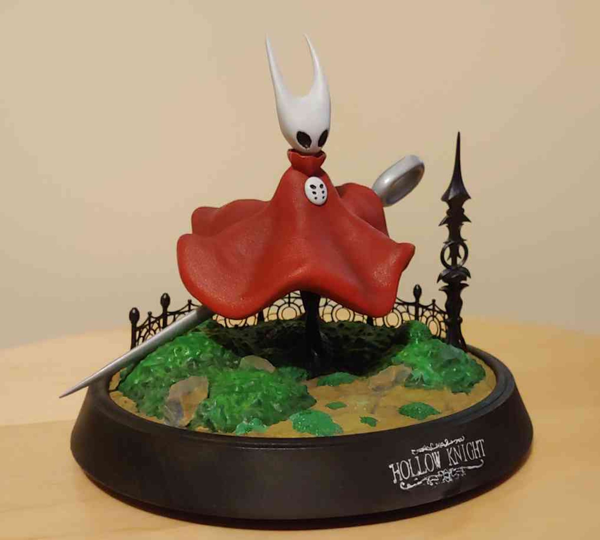 A painted resin statue of Hornet from the game Hollow knight.