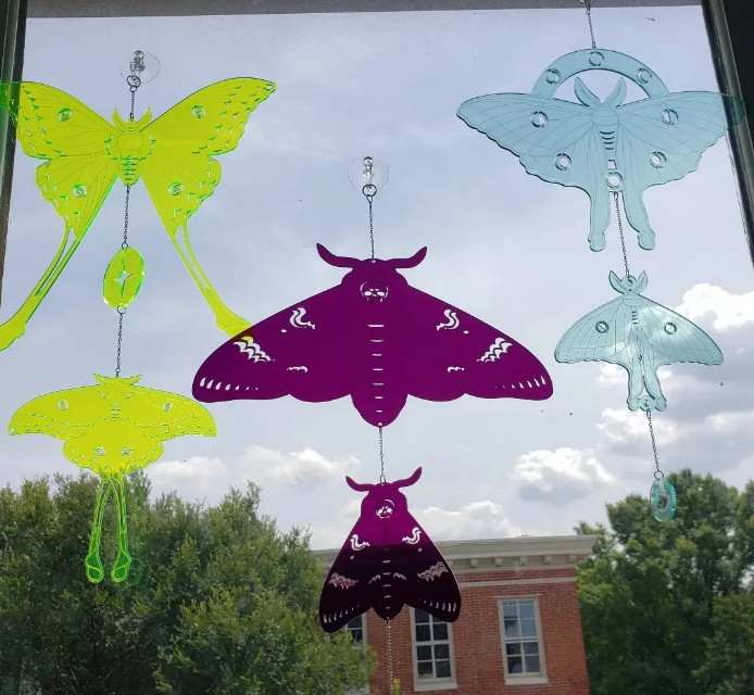 3 moth themed sun catchers. they depict a comet moth, death's head moth, and luna moth.