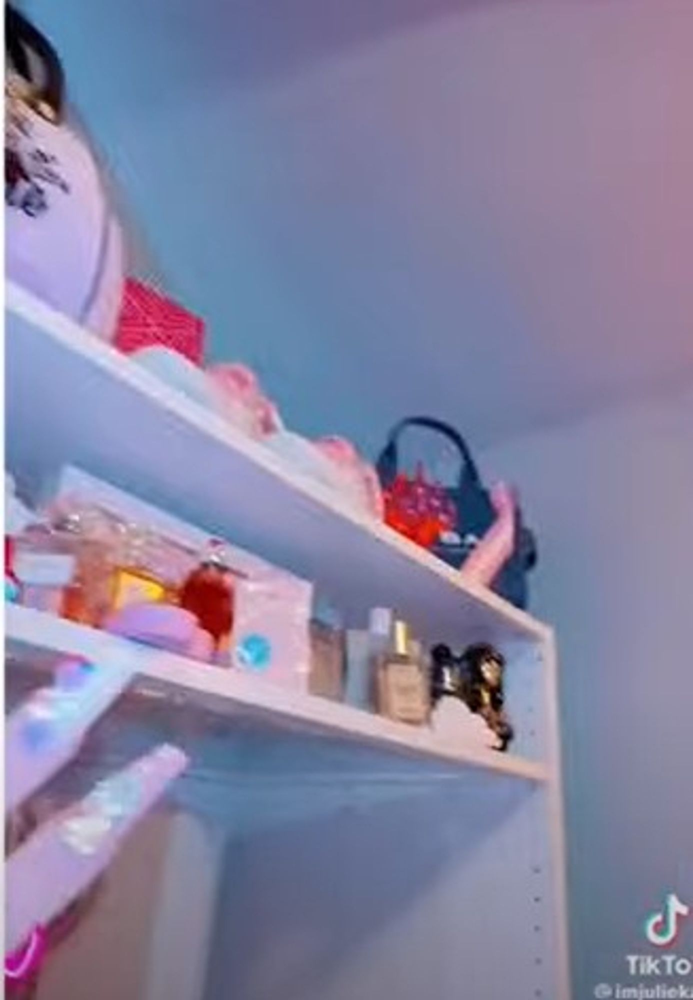 from a restock tiktok: two closet shelves stocked with purses and skincare