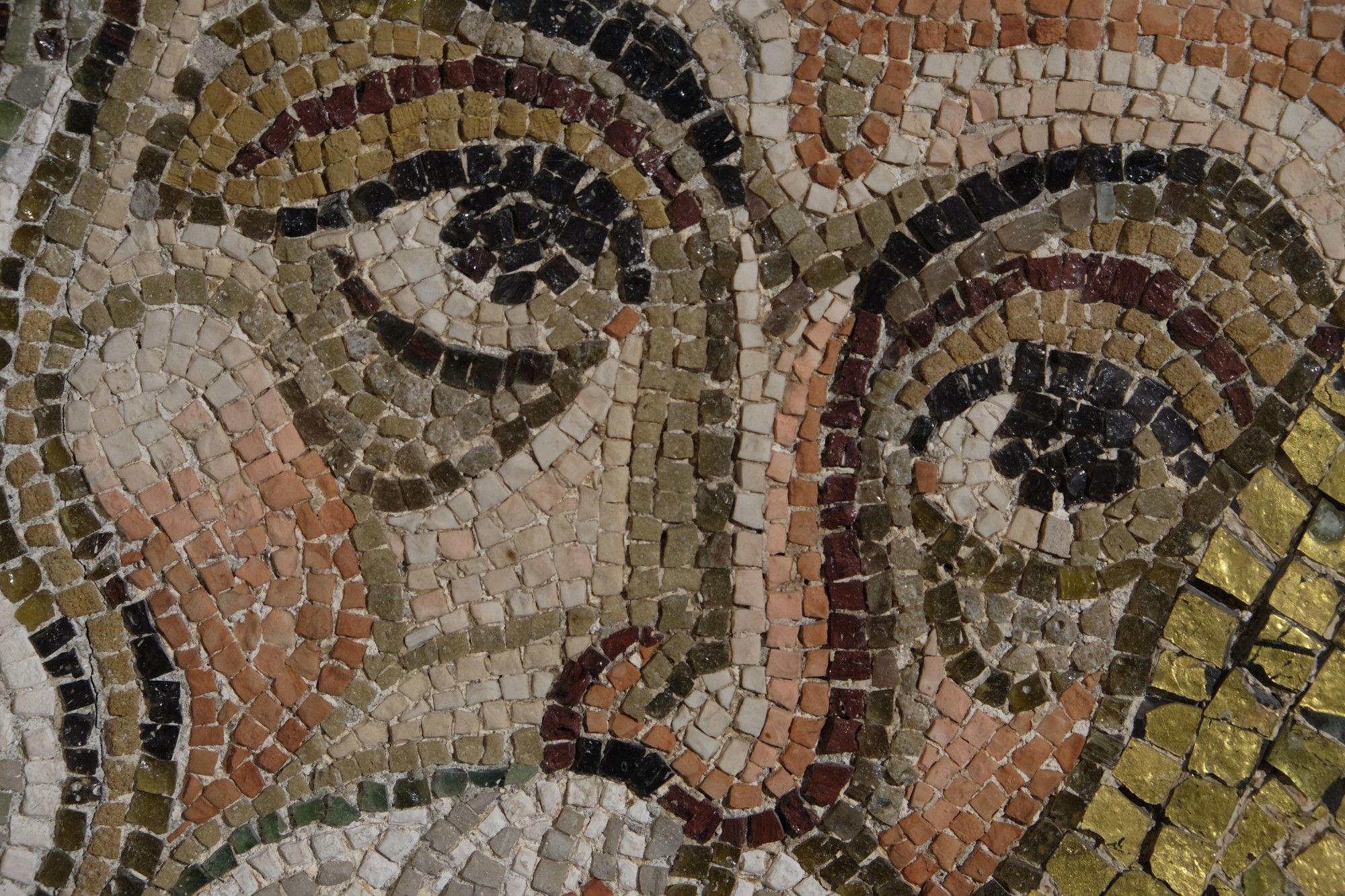 Mosaic fragment of an apostle's face at the Museo arcivescovile.