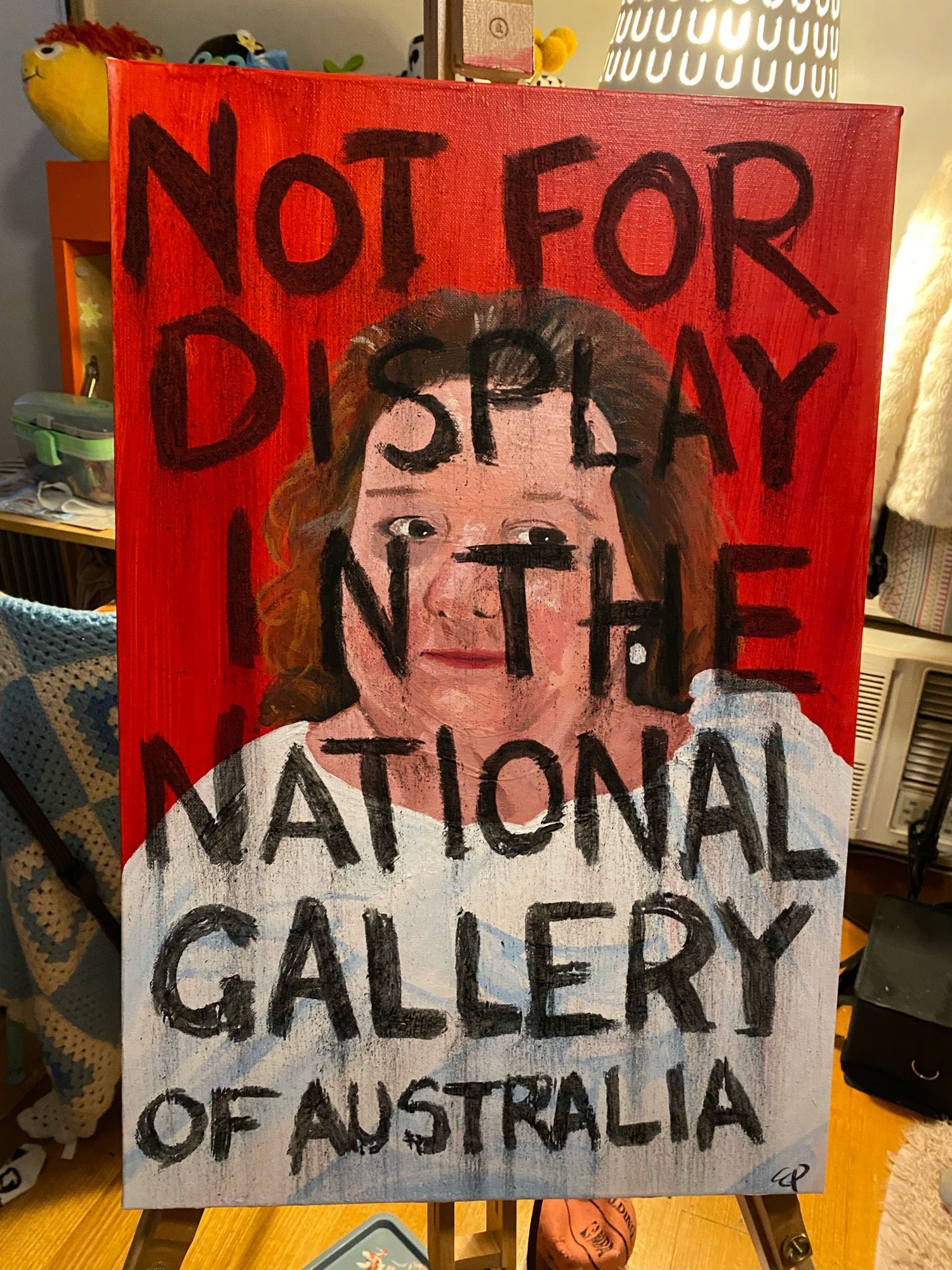 The same acrylic painted portrait of Gina Rinehart as the previous post, but now charcoal text reading “NOT FOR DISPLAY IN THE NATIONAL GALLERY OF AUSTRALIA” is scrawled over the top of it.