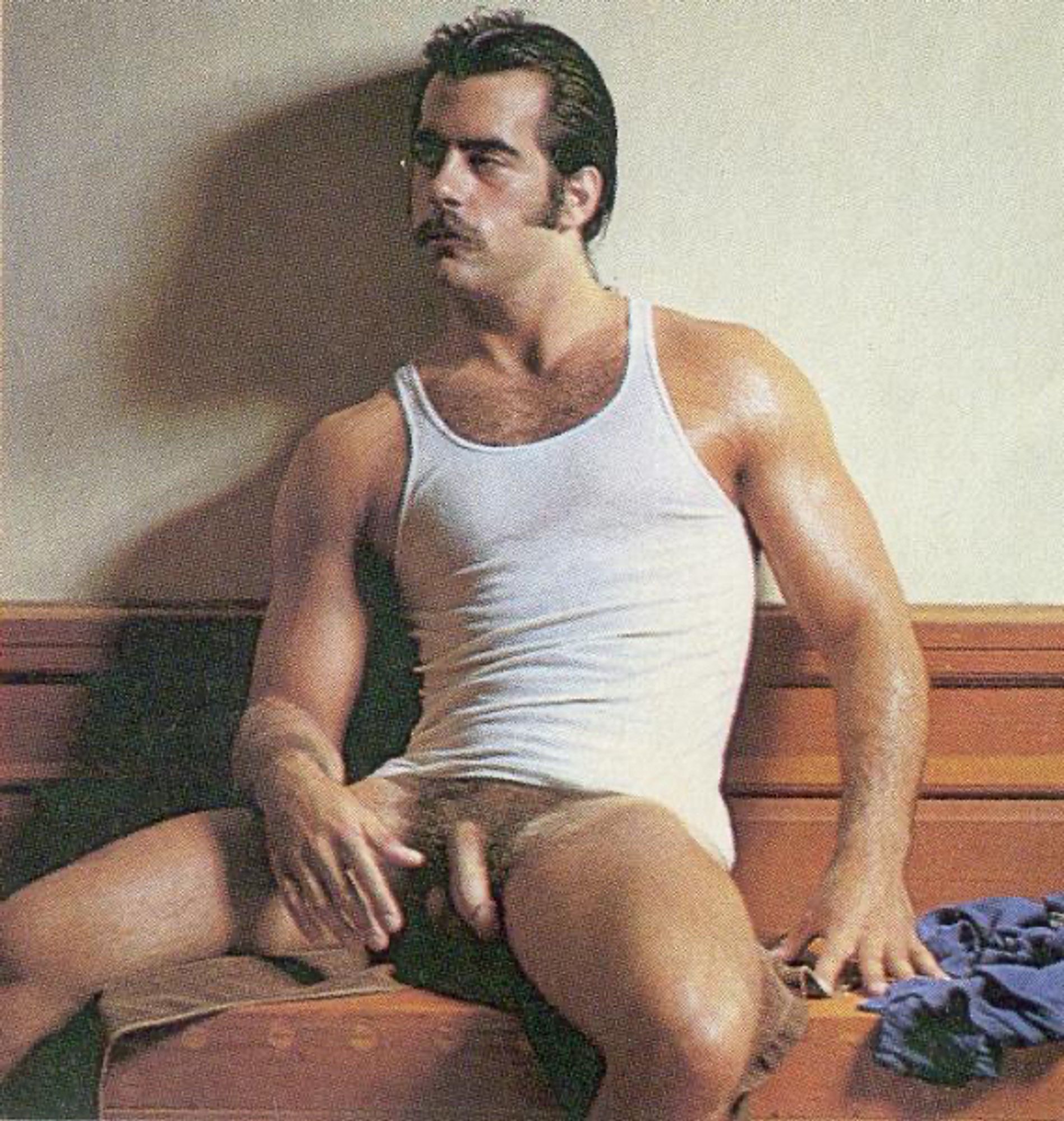 1970s Playgirl centerfold Jean Luc. Wearing a tank top and nothing else.