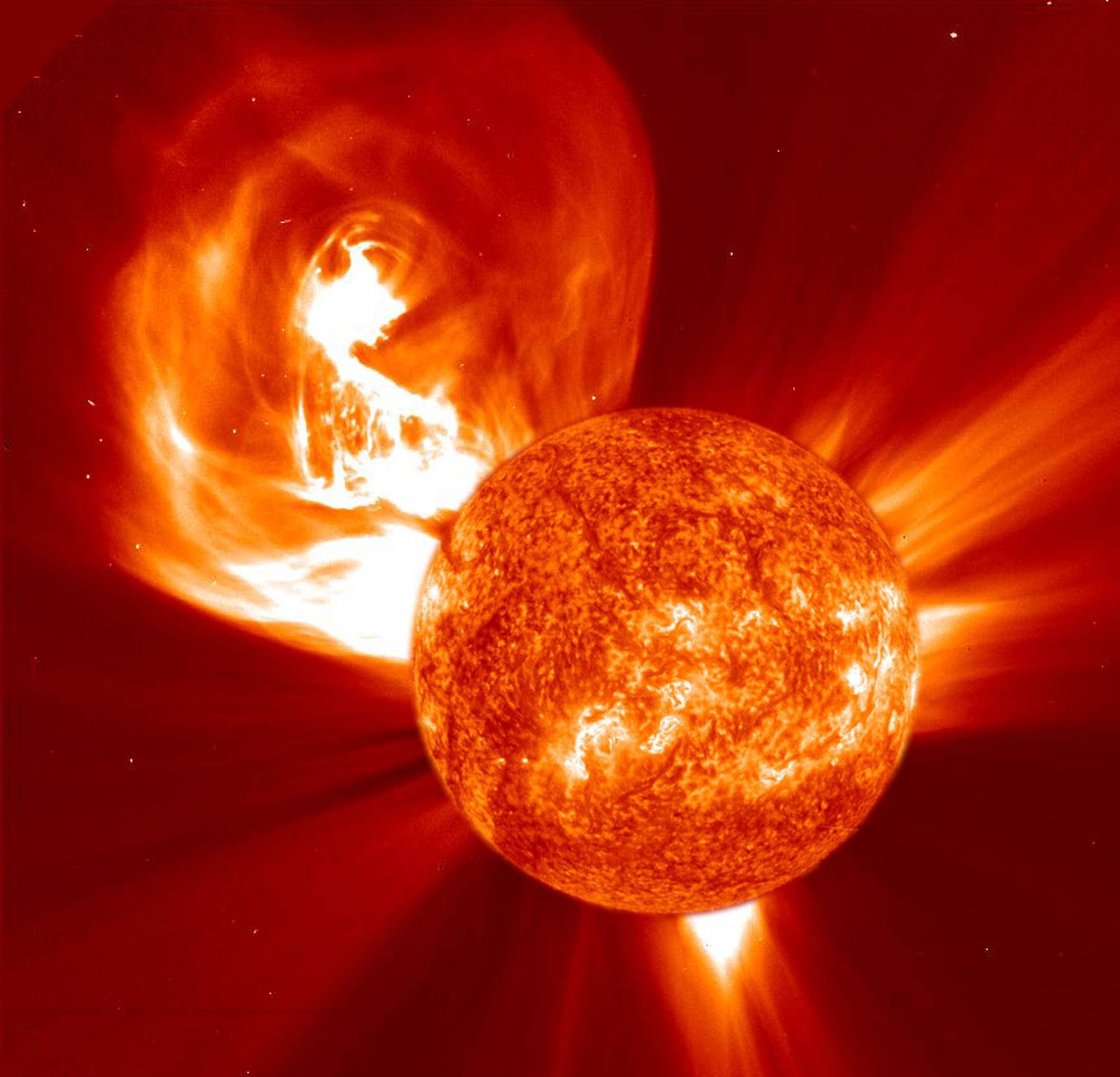 "Our Sun will sometimes, for reasons not entirely understood, eject huge amounts of matter, mostly electrons and protons, from its atmosphere, the "corona". These are known as coronal mass ejections (CMEs). This one occurred on 4 January 2002.     The sun's corona is studied through a special camera on NASA's solar-orbiting observatory, SOHO. The camera (called "LASCO") has an occulting disk to block out the bright sphere of the sun so that the relatively dim corona can be observed. In this image a separate photograph of the sun (taken about the same time by a different SOHO instrument) has been scaled and superposed over the occulting disk."