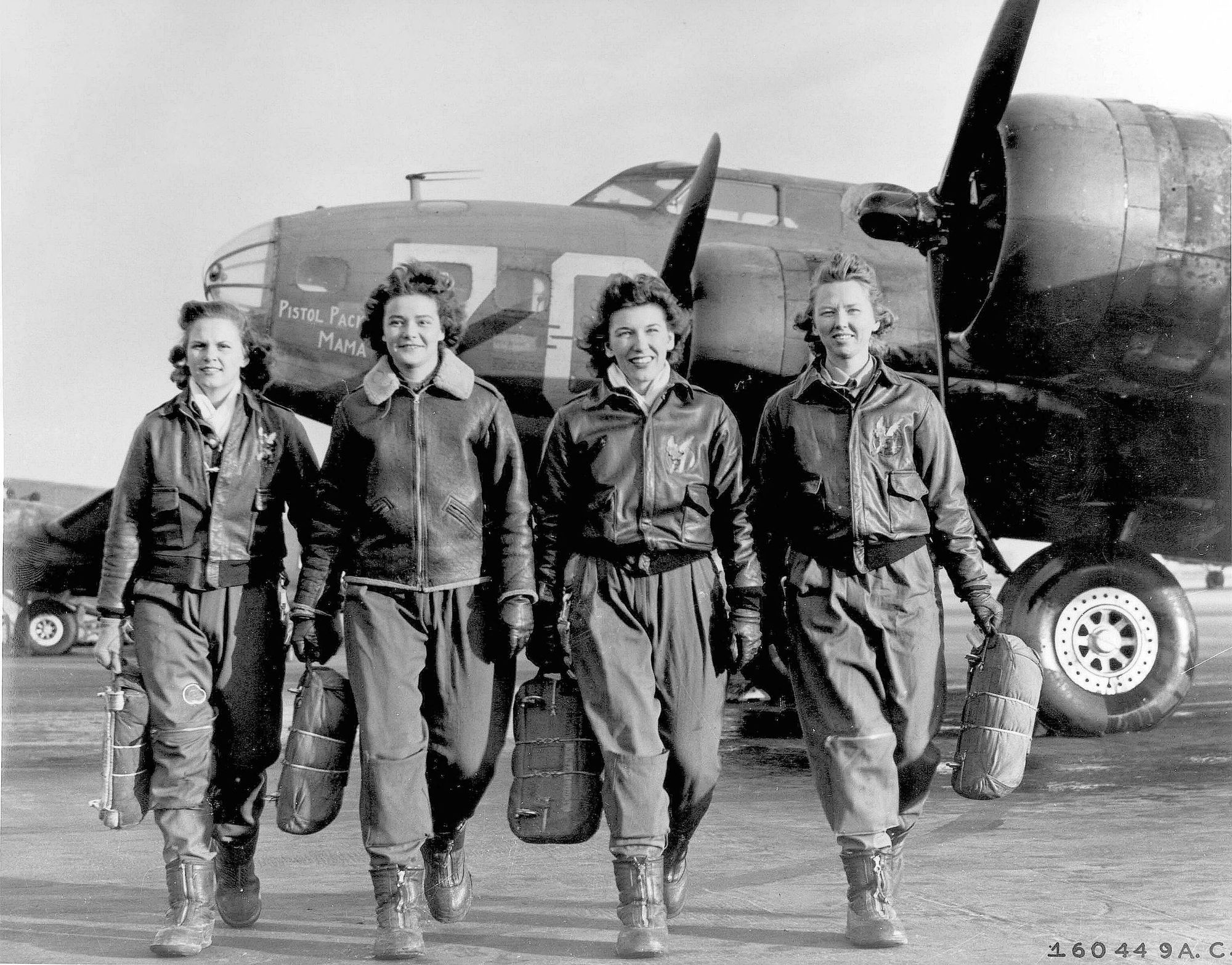 Frances Green, Margaret (Peg) Kirchner, Ann Waldner and Blanche Osborn leaving their plane, a B-17 Flying Fortress named “Pistol Packin’ Mama,” at the four-engine school at Lockbourne AAF, Ohio, during WASP ferry training.