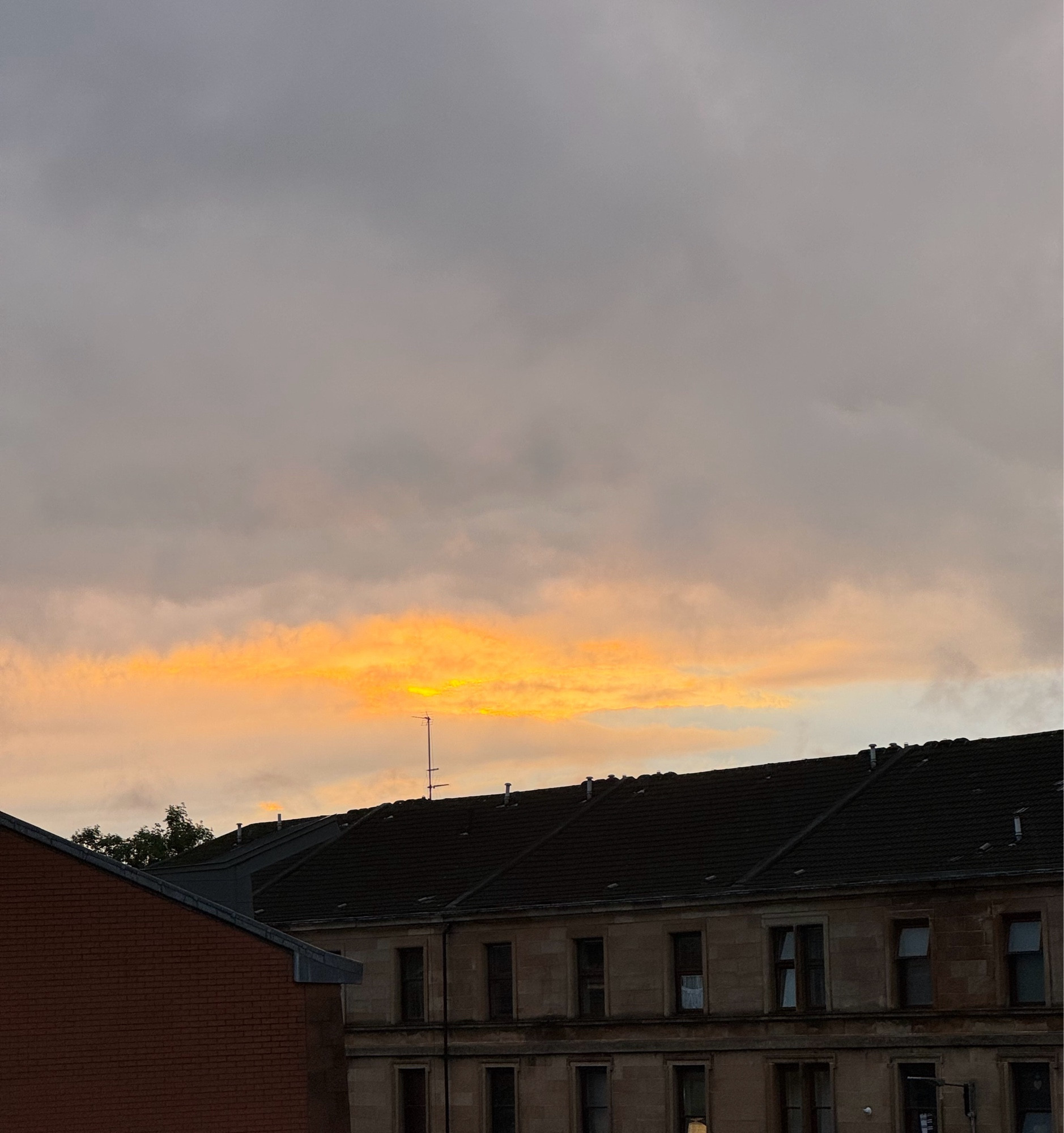 A bit of sunset showing through heavy clouds