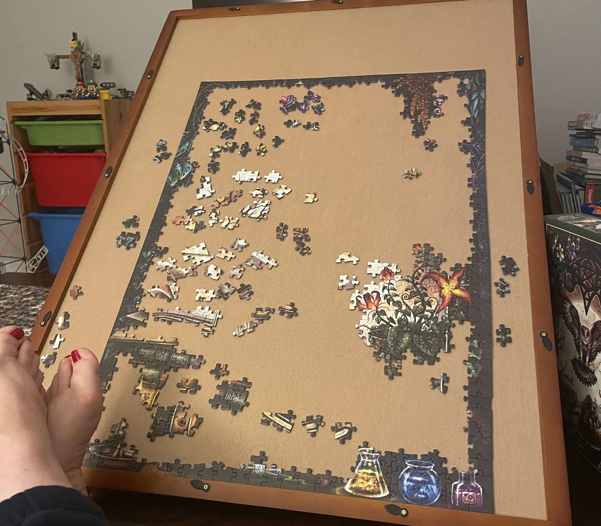 An easel puzzle board, with a jigsaw puzzle in progress.