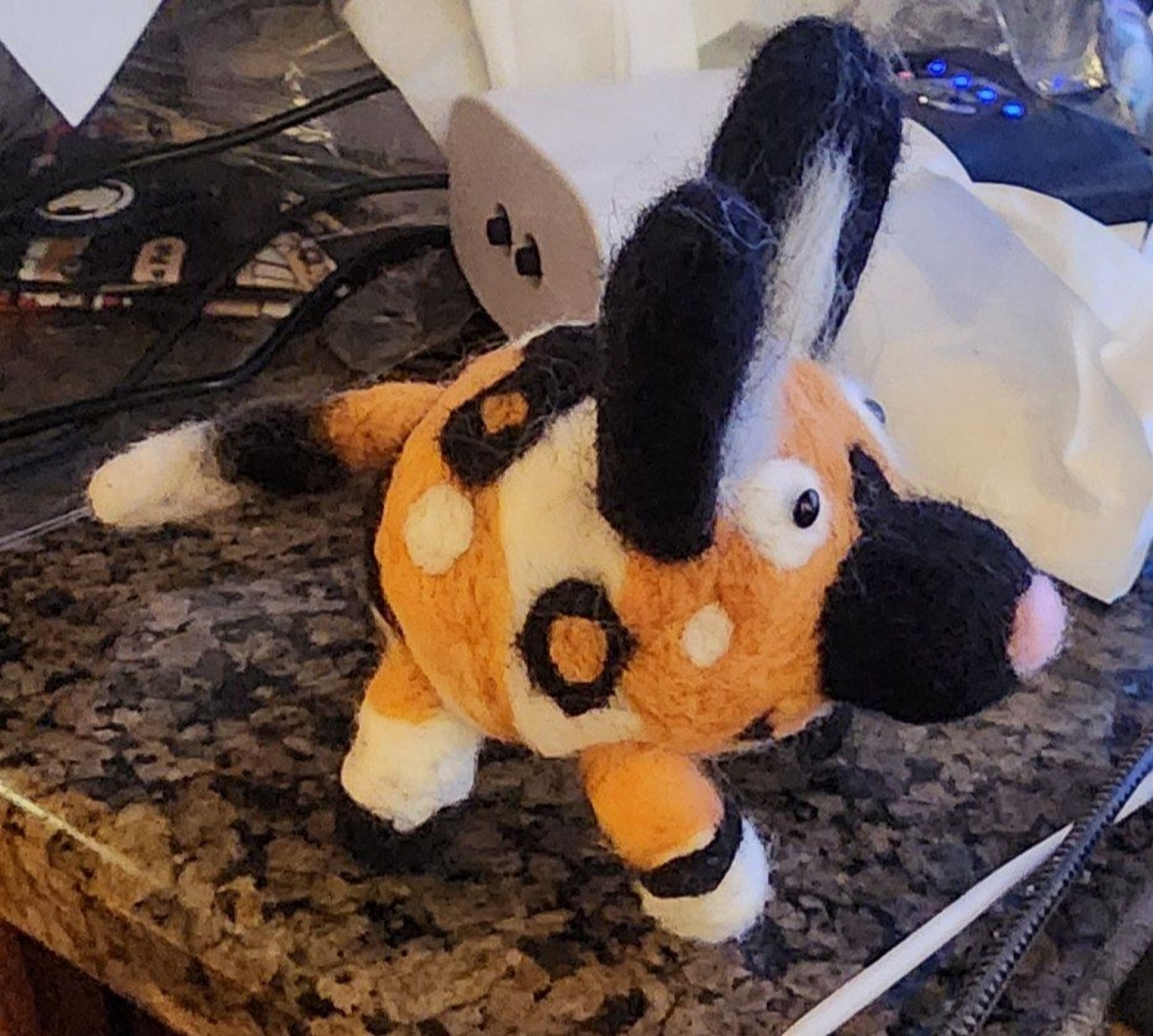 Needle felt African wild dog with a pink nose