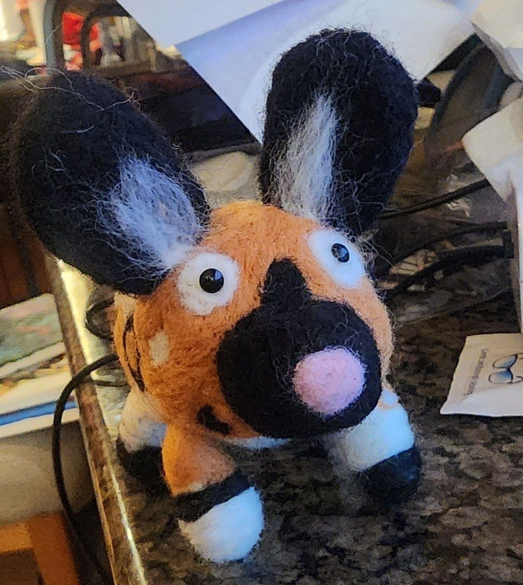 Needle felt African wild dog with a pink nose