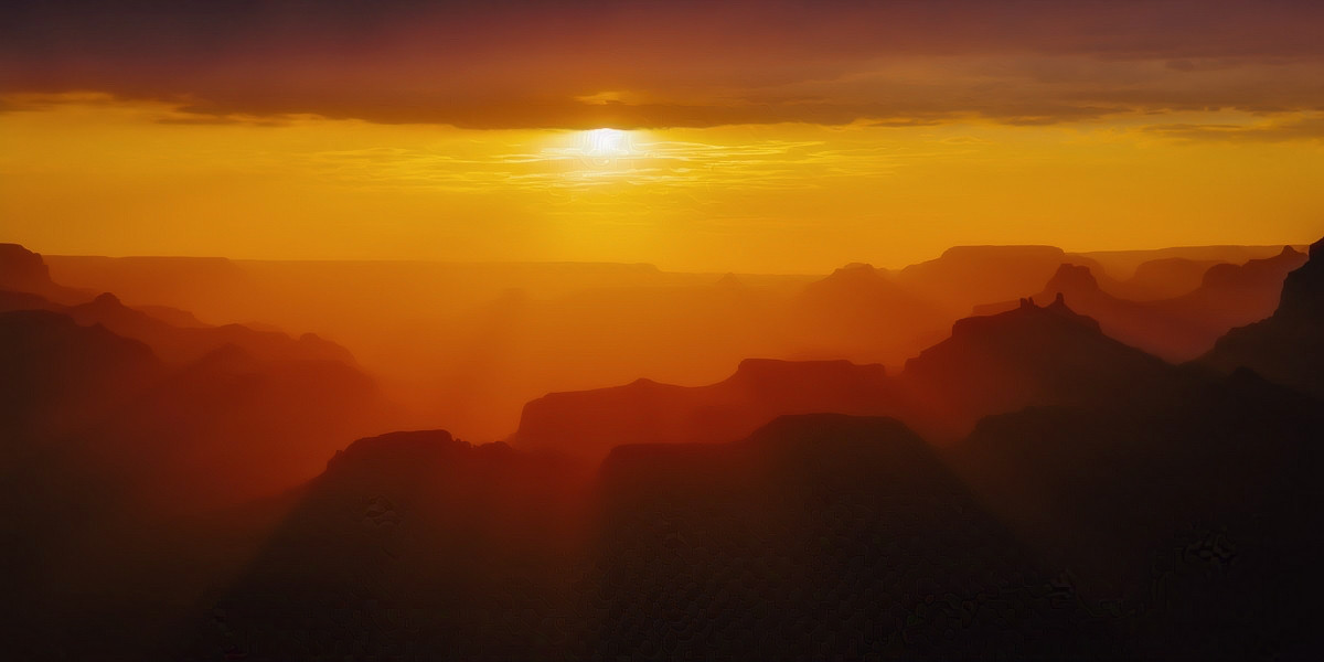 A sunset over the Grand Canyon.

The view is straight ahead and over the Grand Canyon. The overall scene is full of reds, oranges and yellows. 

Heavy clouds occupy the top of the image. Just below the clouds is the sun, which is very, very bright. Sun rays project over the rest of the scene.

The sky is clear below the sun and mostly yellow.

The canyon walls and features are in stark relief in the rest of the photograph. They project up and into the canyon, making for a striking layered effect.

The bottom of the frame is all shadowed.