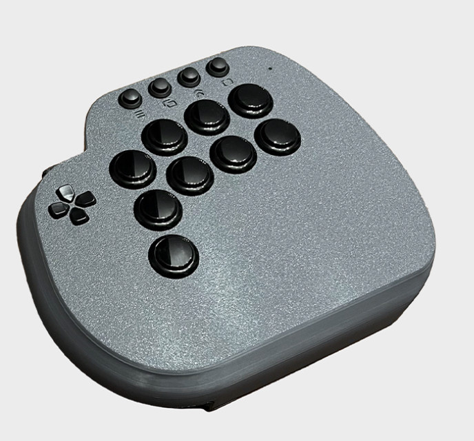 A fighting game controller with 9 buttons on the right and side and a dpad on the left