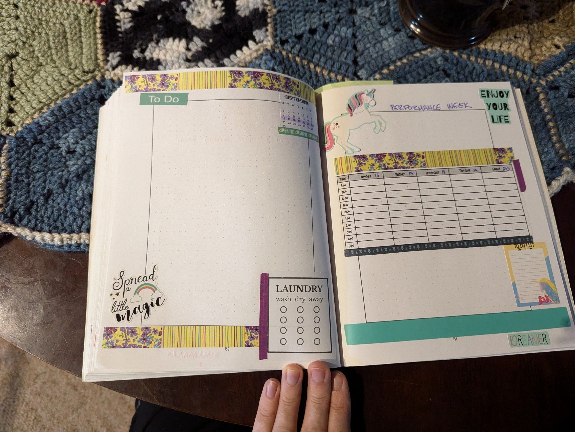 A teal, yellow, and purple layout with a September 2024 calendar, a large sticker laying out the work week hourly from 8 to 5, and a Laundry sticker that has separate steps for wash, dry, and put away.