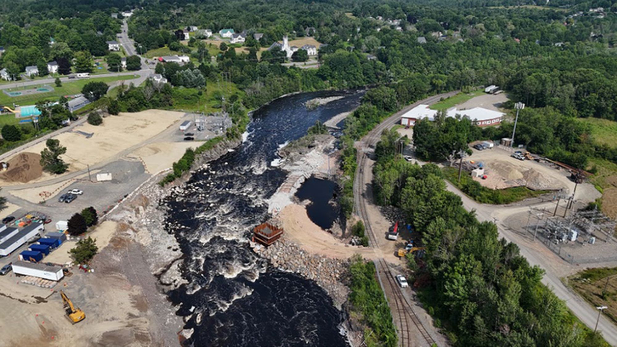 Water flows through the site of the former Milltown Dam on July 31, 2024, with remaining structures still being removed. Credit: New Brunswick Power