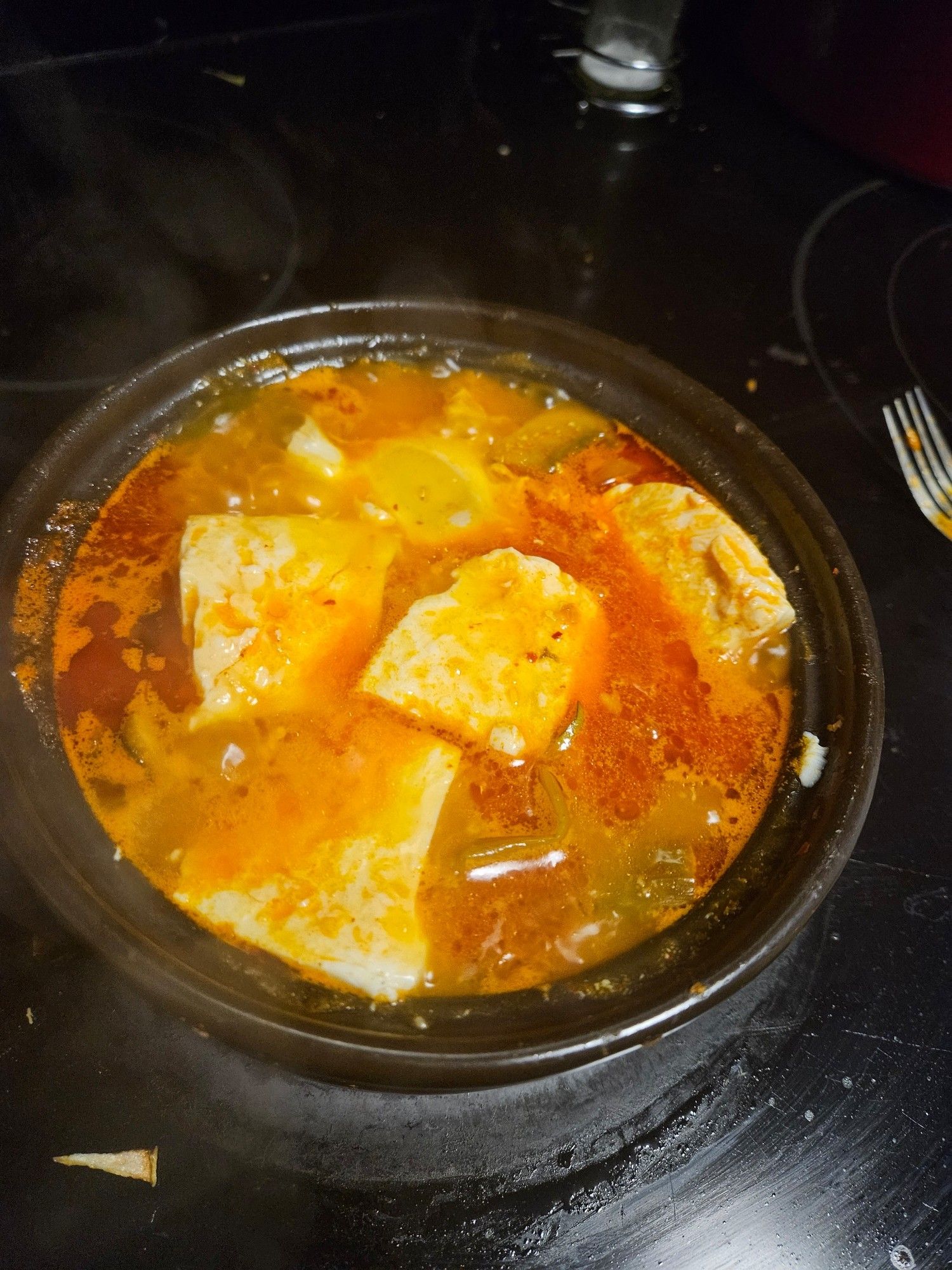 A beautiful dolsot of kimchi sundubu jjigae.