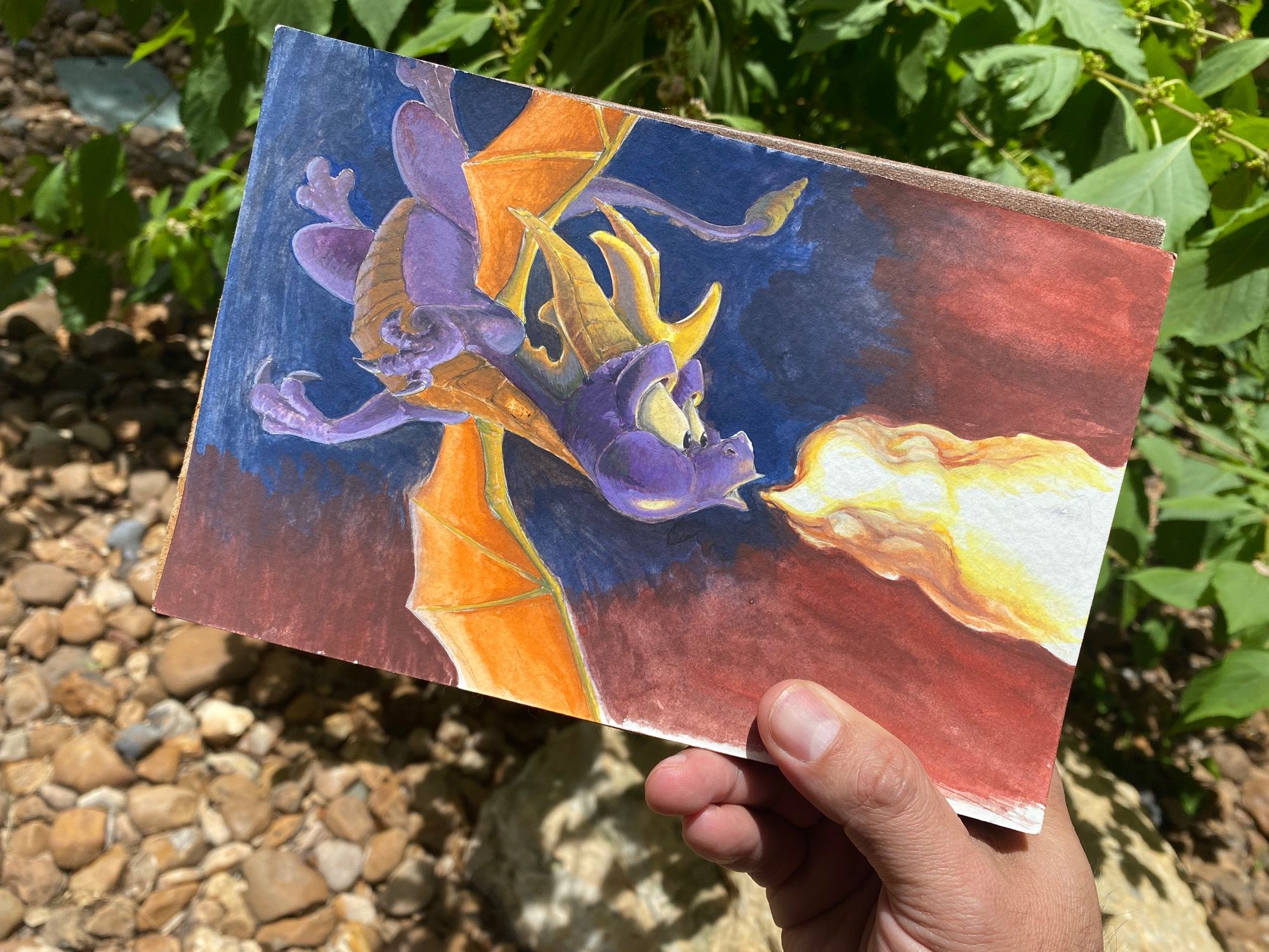 Gouache painting depicting a fire breathing Spyro.