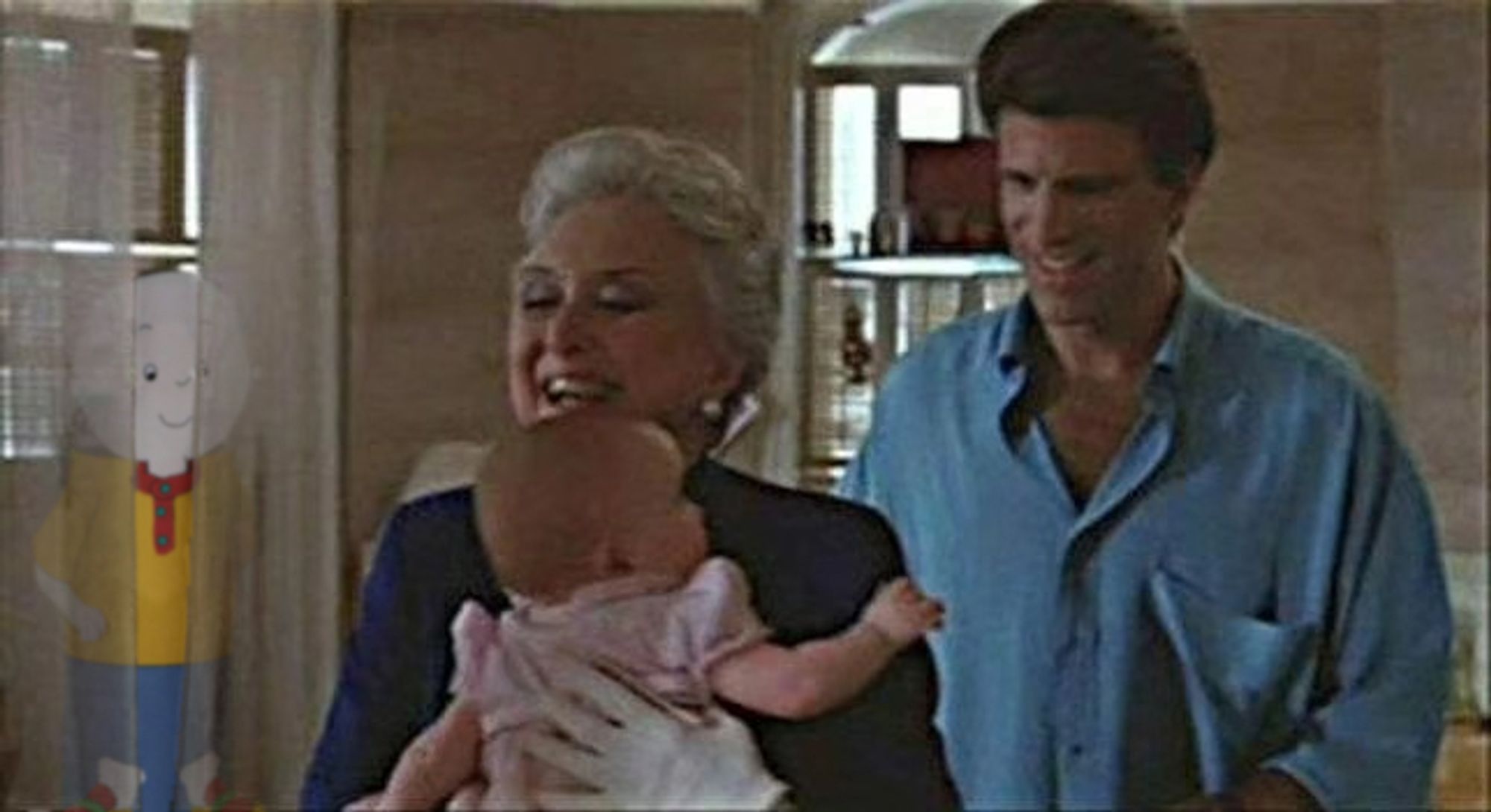 A scene from Three Men and a Baby. This shot is an urban legend. Ted Danson and an older actress whose name escapes me walk with a baby through Ted Danson's apartment. People claim in this shot, you can see the ghost of a child behind the curtains, but it's just fucking Caillou.