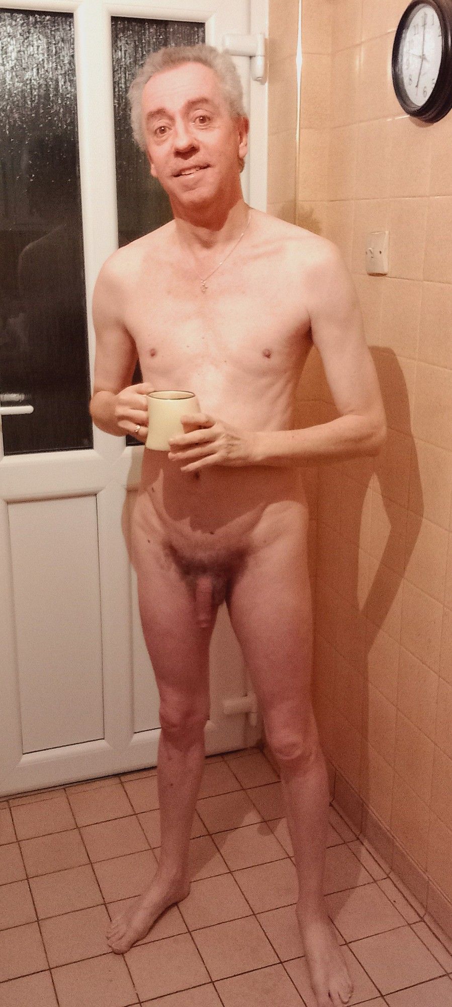 A nudist with a cup of tea