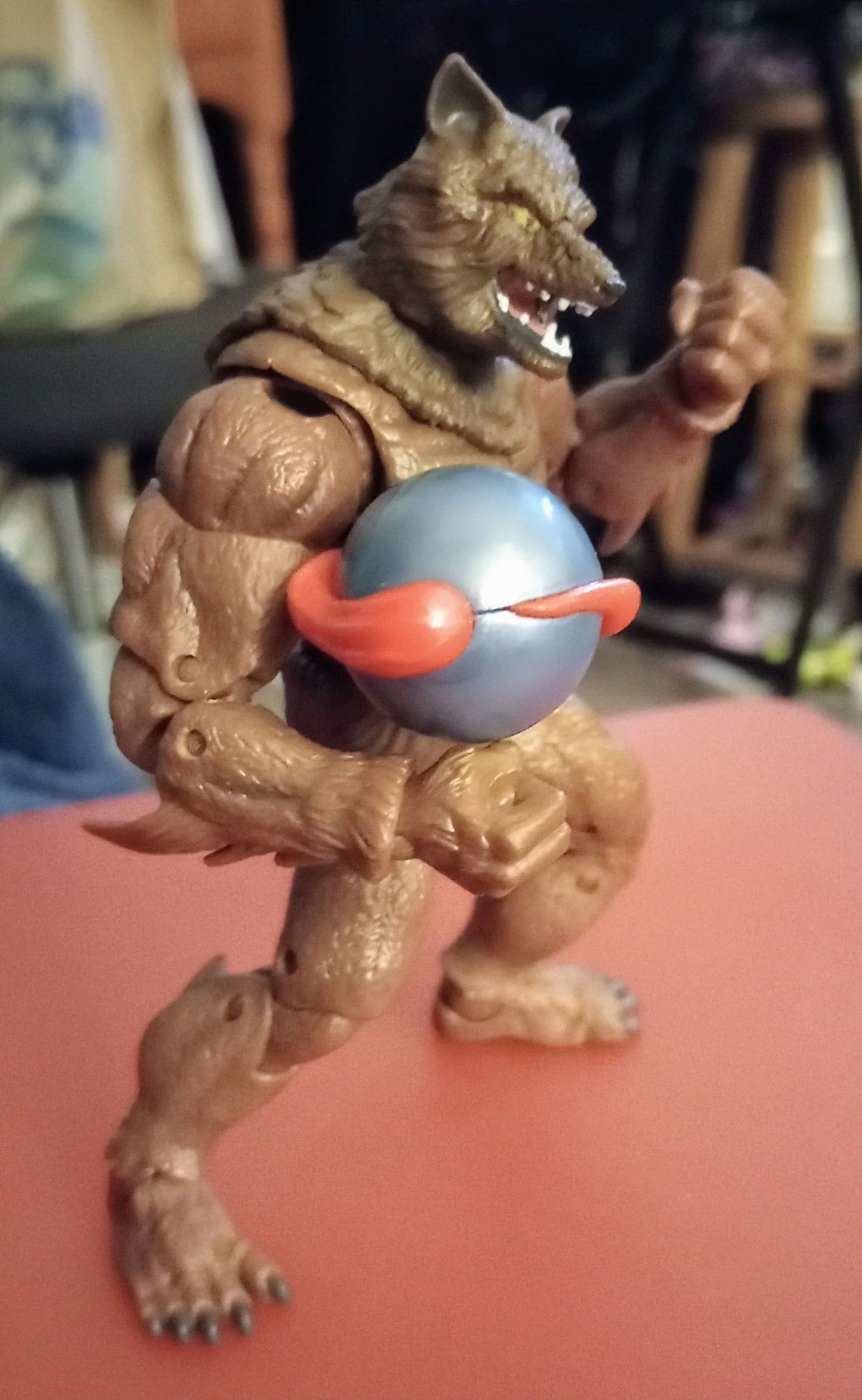 Brown werewolf holding a silver and red orb, based on the Sega Genesis video game property "Altered Beast."