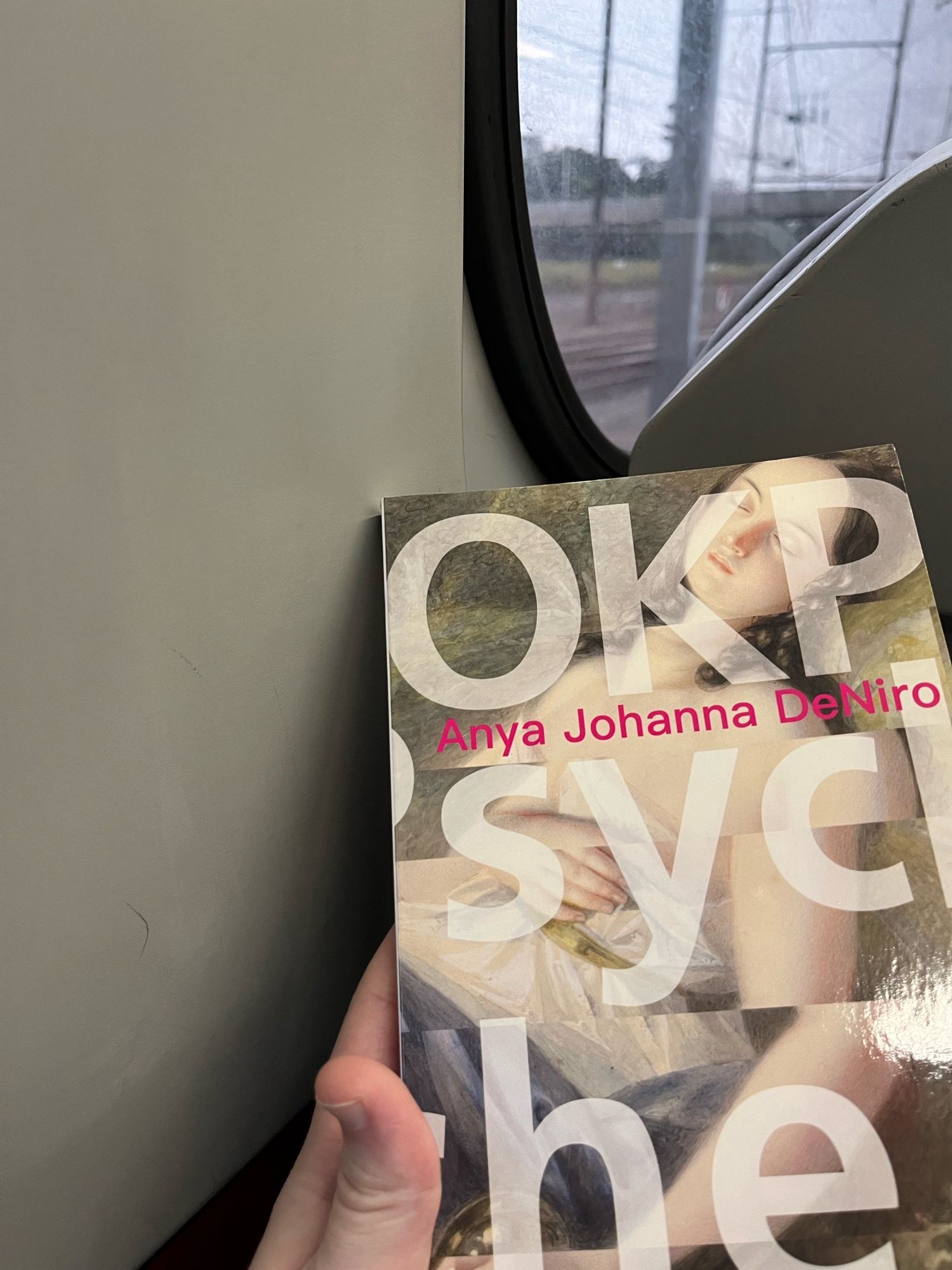 OKPsyche by Anna Johanna DeNiro.  I’m sitting on the train, cover has a fainting woman in renaissance style