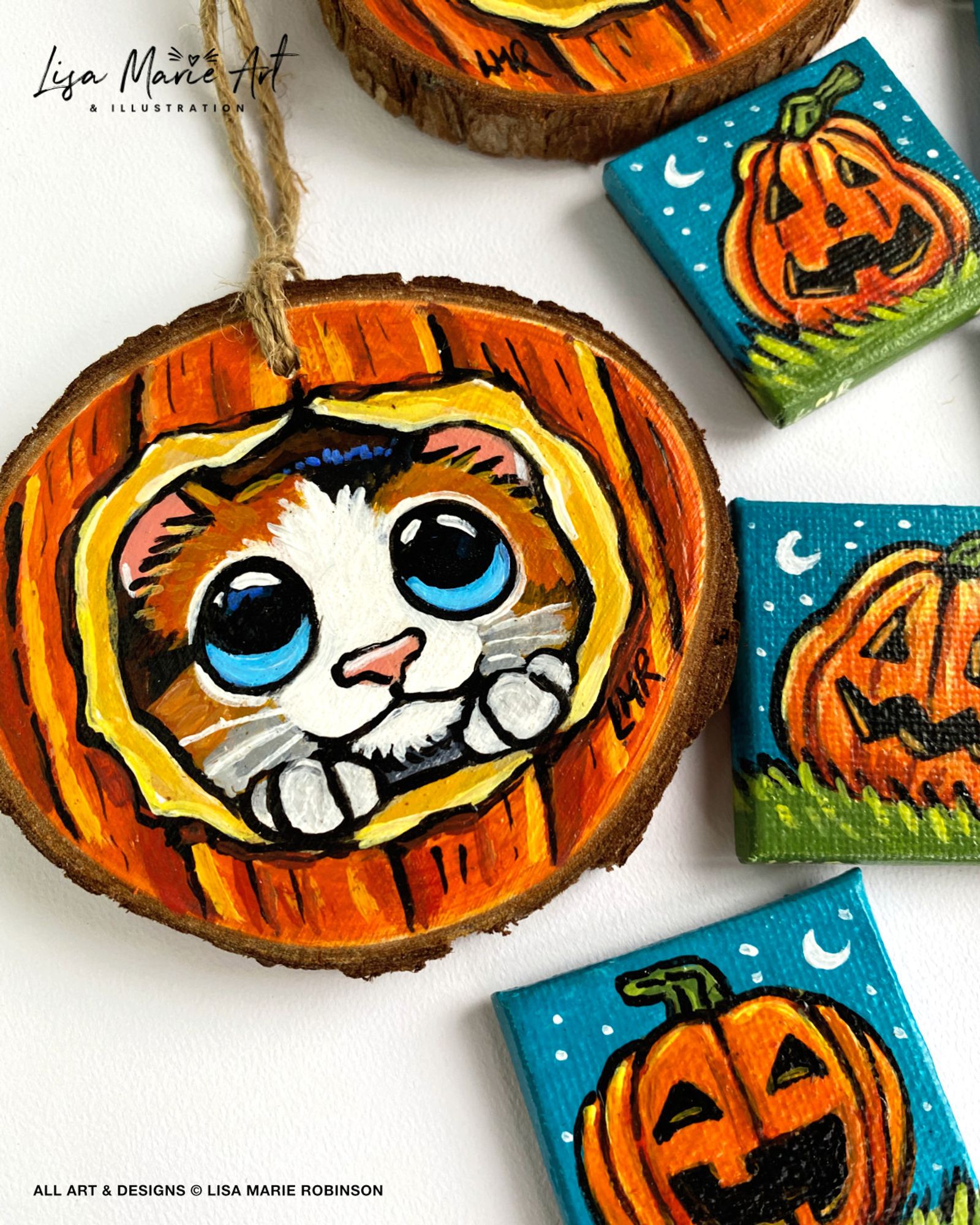 Photo of a wooden cat decoration with twine for hanging, and pumpkin magnets. All handmade, hand-painted and unique.