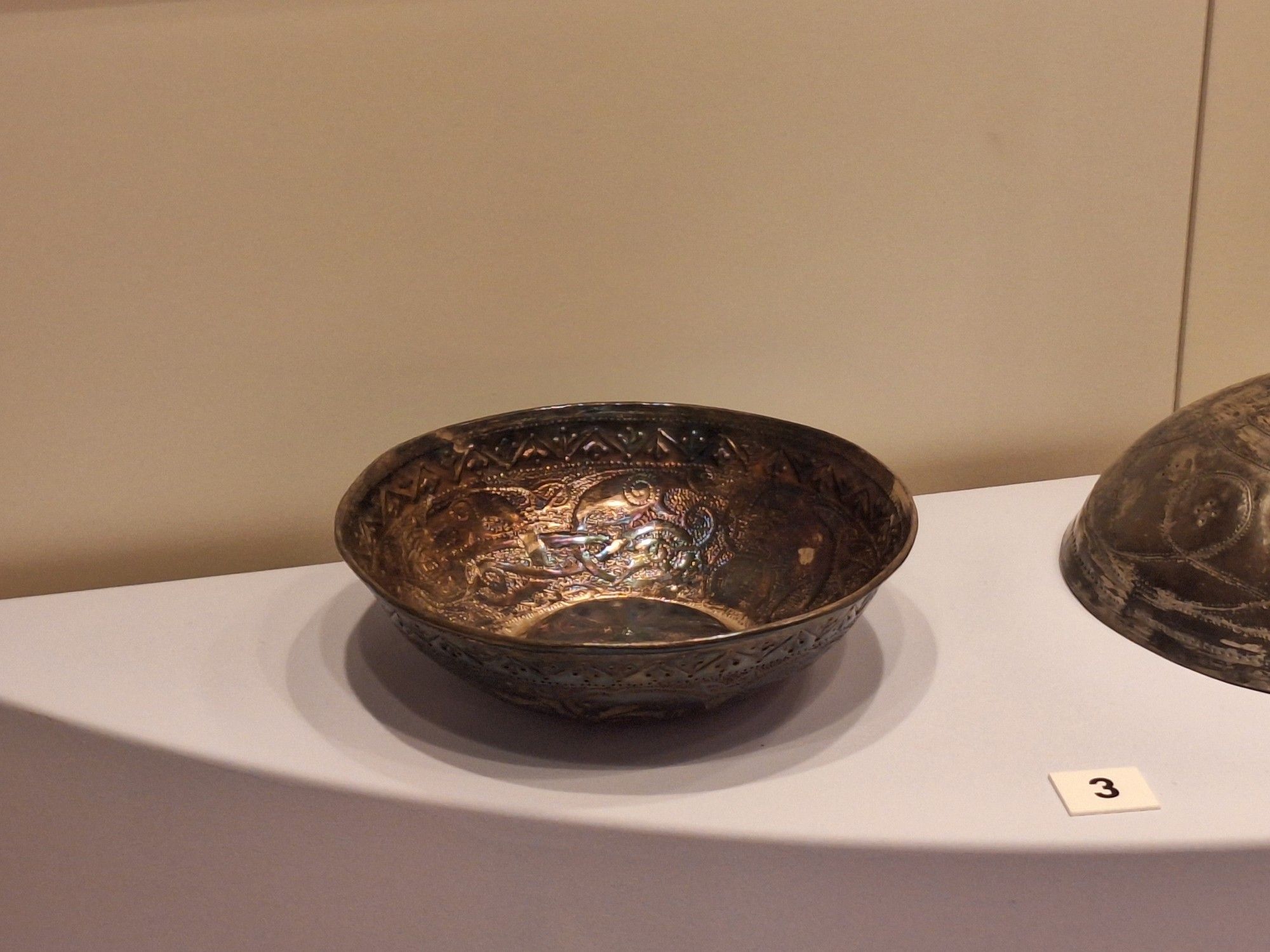 Silver bowl replica of St. Ninian's treasure with an elaborated pattern.