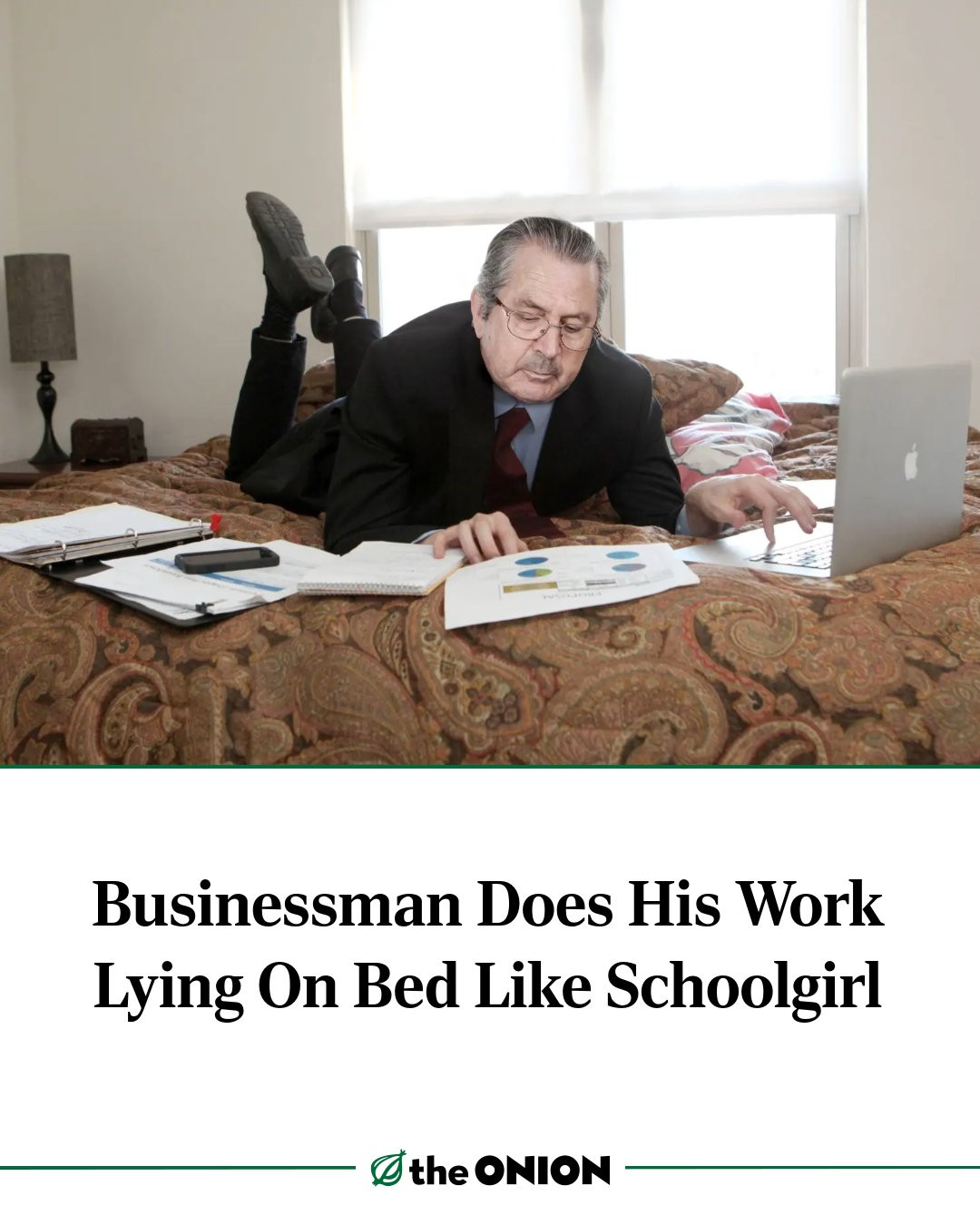 Businessman Does His Work Lying On Bed Like Schoolgirl