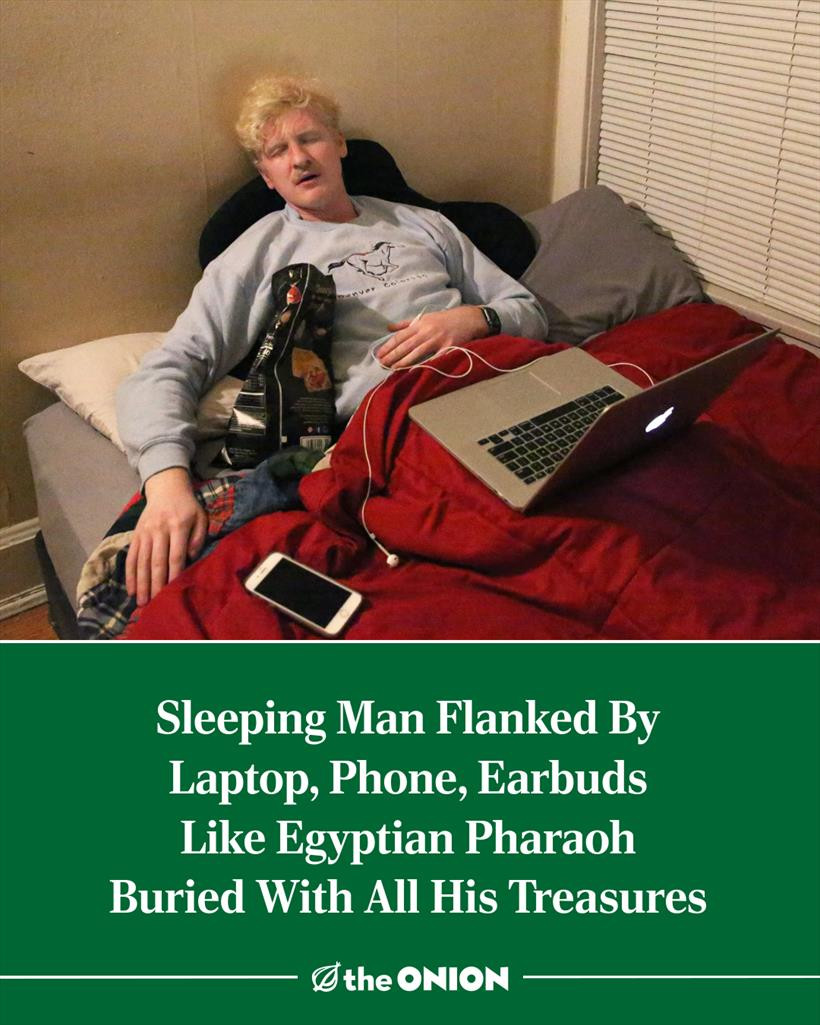 Sleeping Man Flanked By Laptop, Phone, Earbuds Like Egyptian Pharaoh Buried With All His Treasures