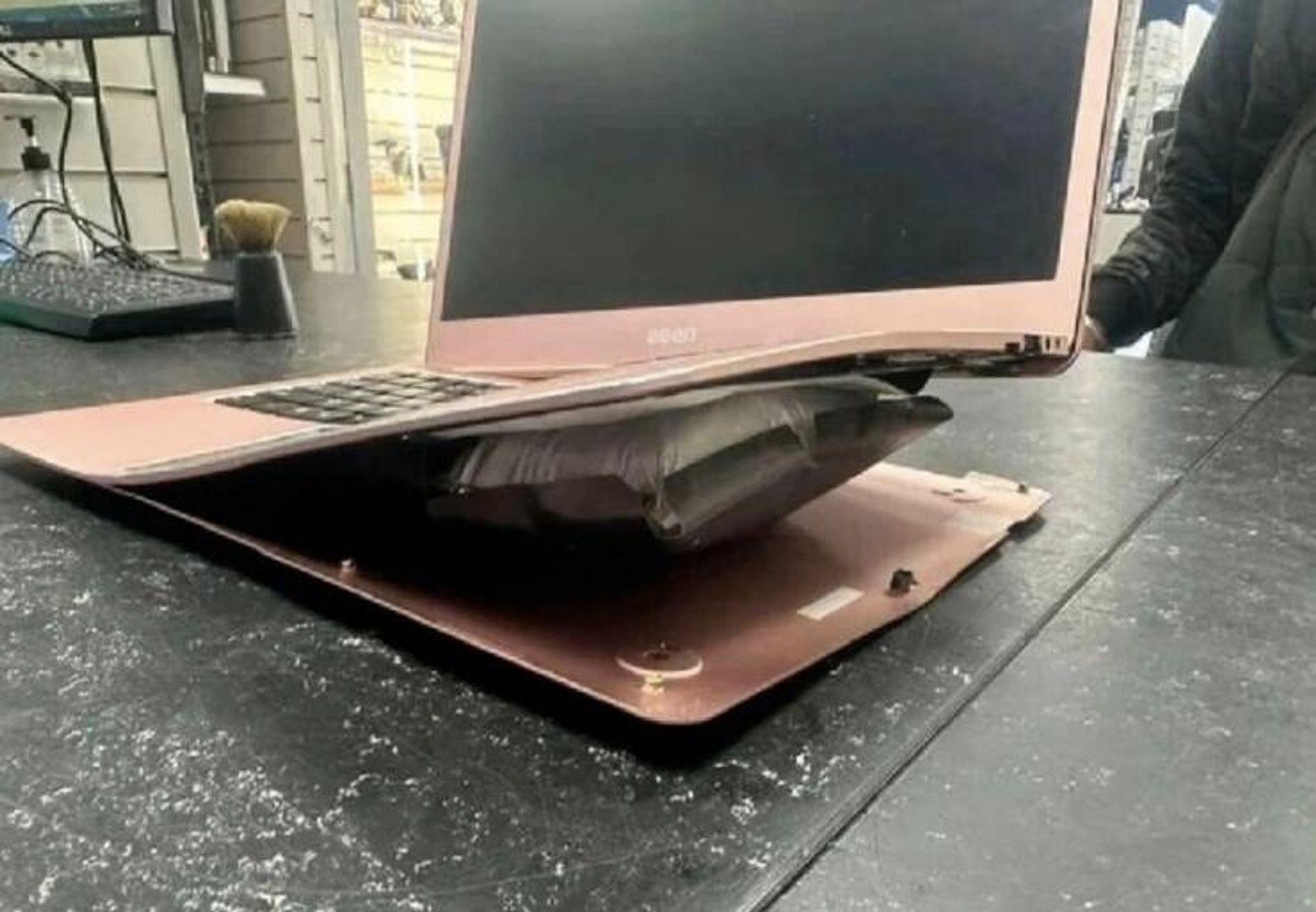 A laptop battery has failed so spectacularly, swelling to twenty times its original thickness, that it bent the main body.