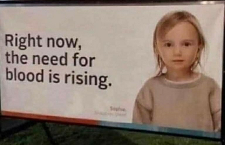 Billboard with a little girl looking straight into the camera and text "Right now, the need for blood is rising"