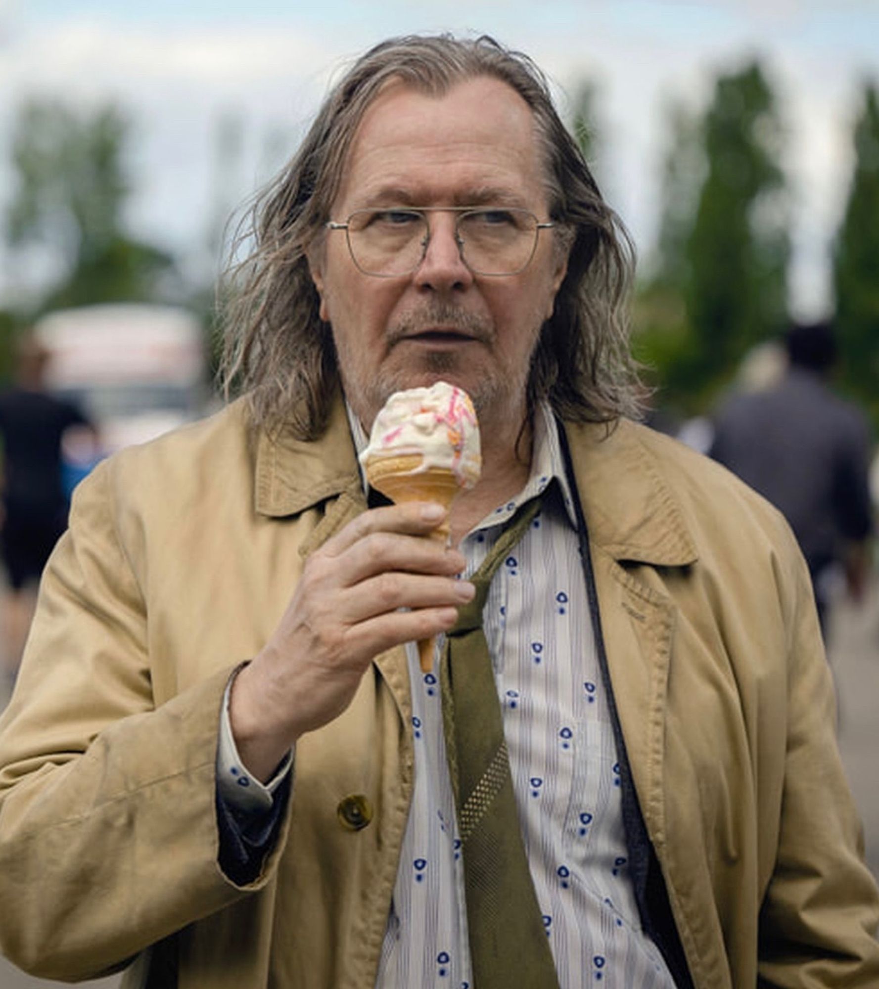 Gary Oldman as Jackson Lamb: greasy hair, unshaven, dirty flasher’s jacket, melting ice cream