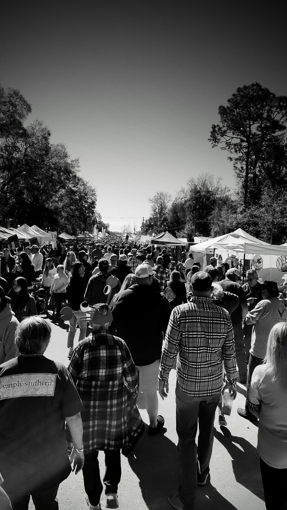 A crowded county fair, taken at the Fiddler Crab Festival in Steinhatchee, Florida, Februrary of 2022.