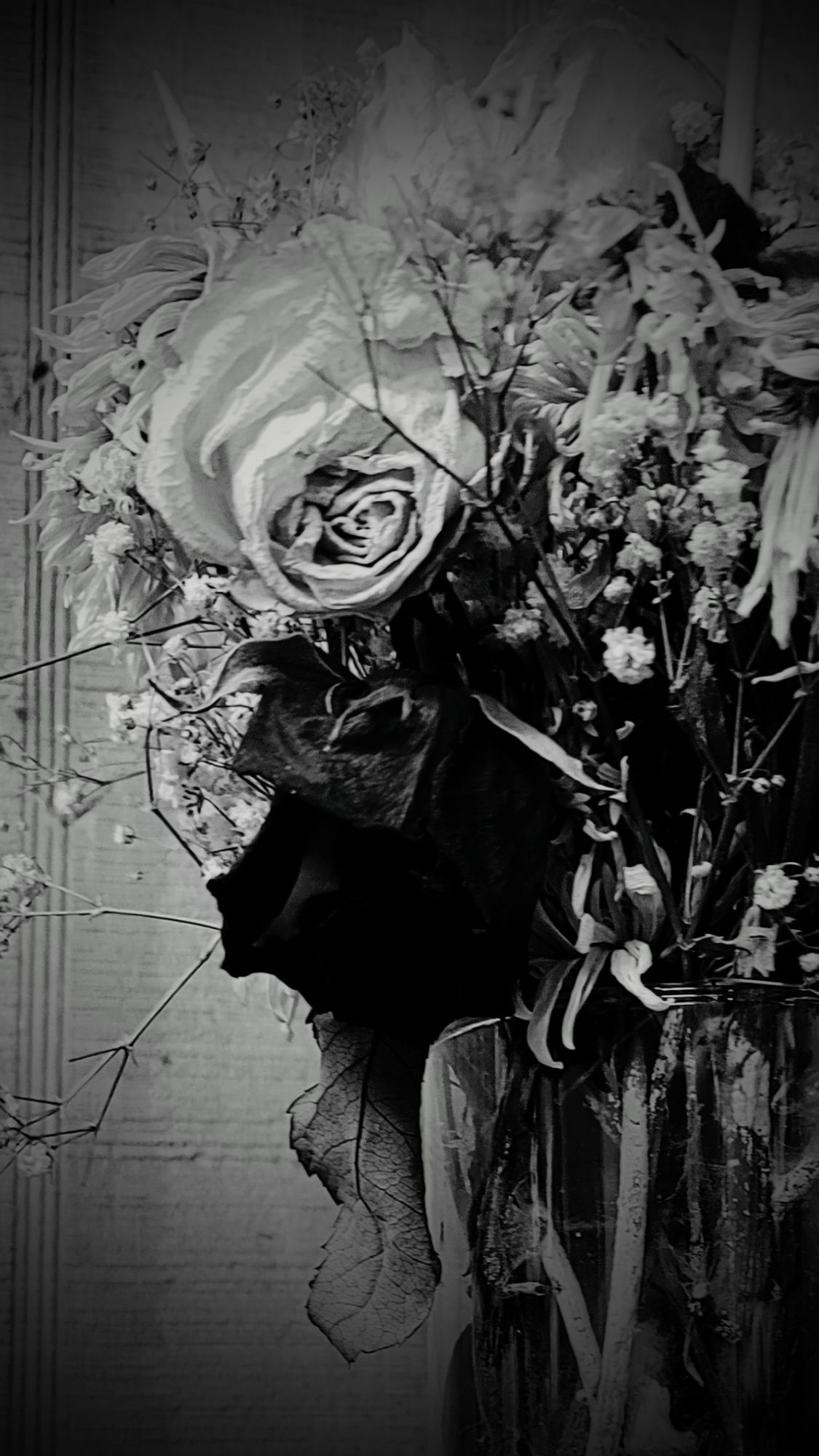 Dried flowers in a vase I had received on Valentine's Day in 2022.