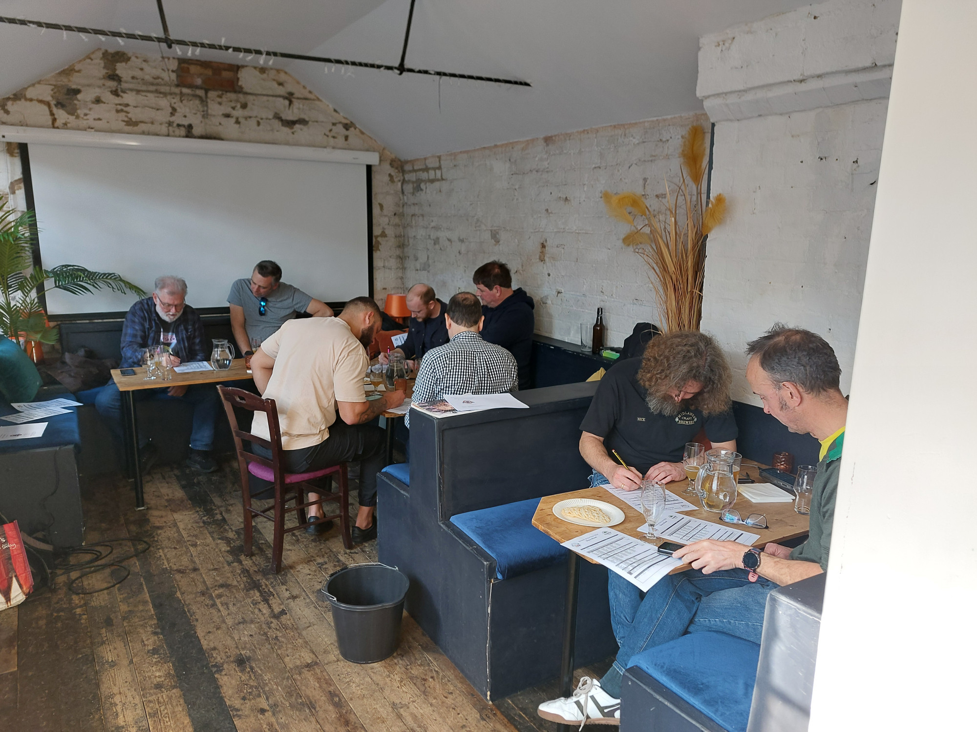 Homebrewers judging beers at a competition