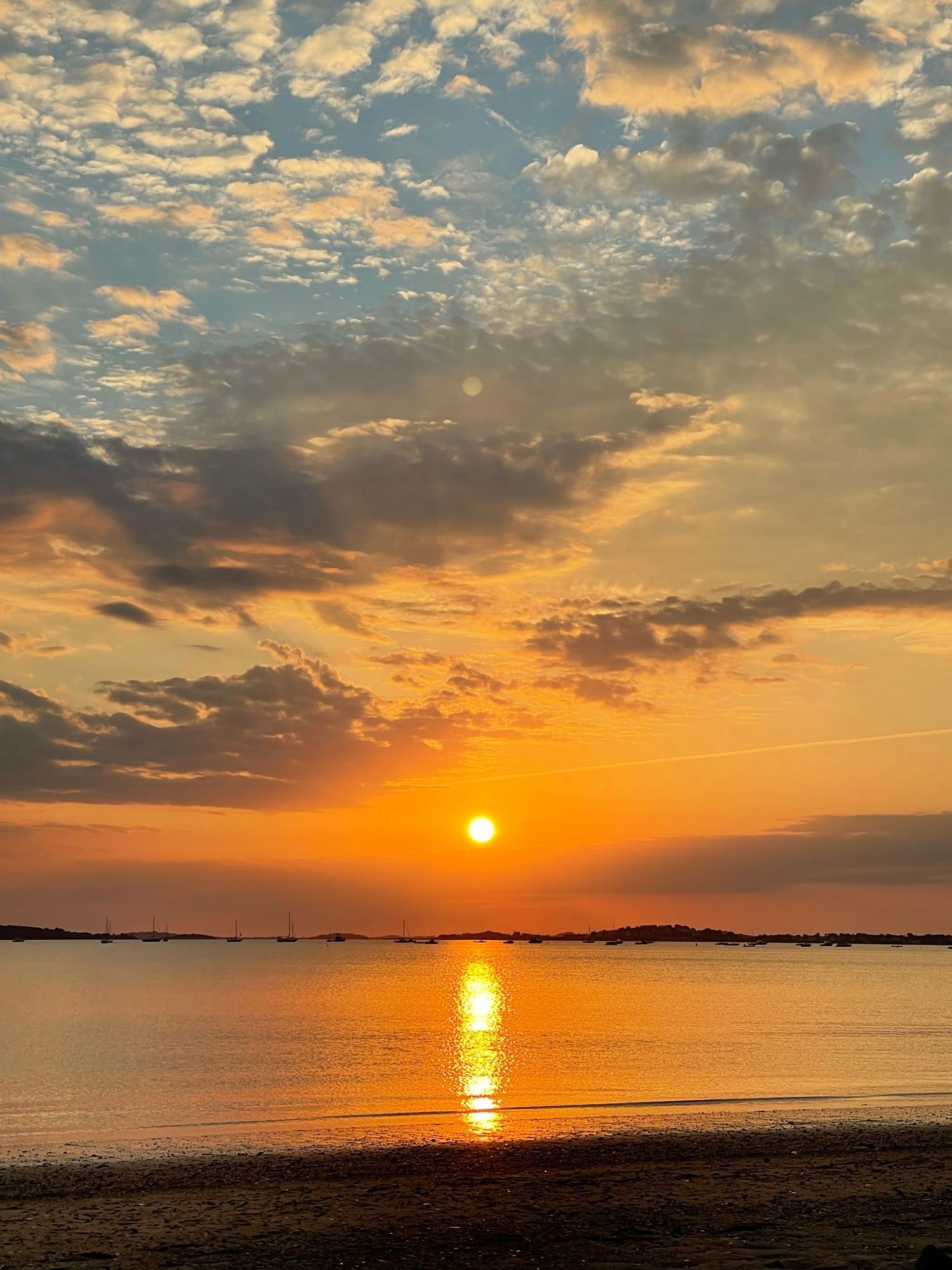 Sunrise over a bay with dramatic cloud sky on Sept 28, 2021