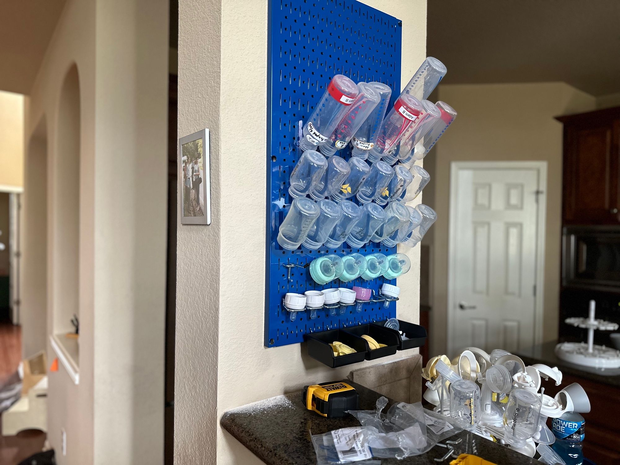 Baby bottles on a pegboard