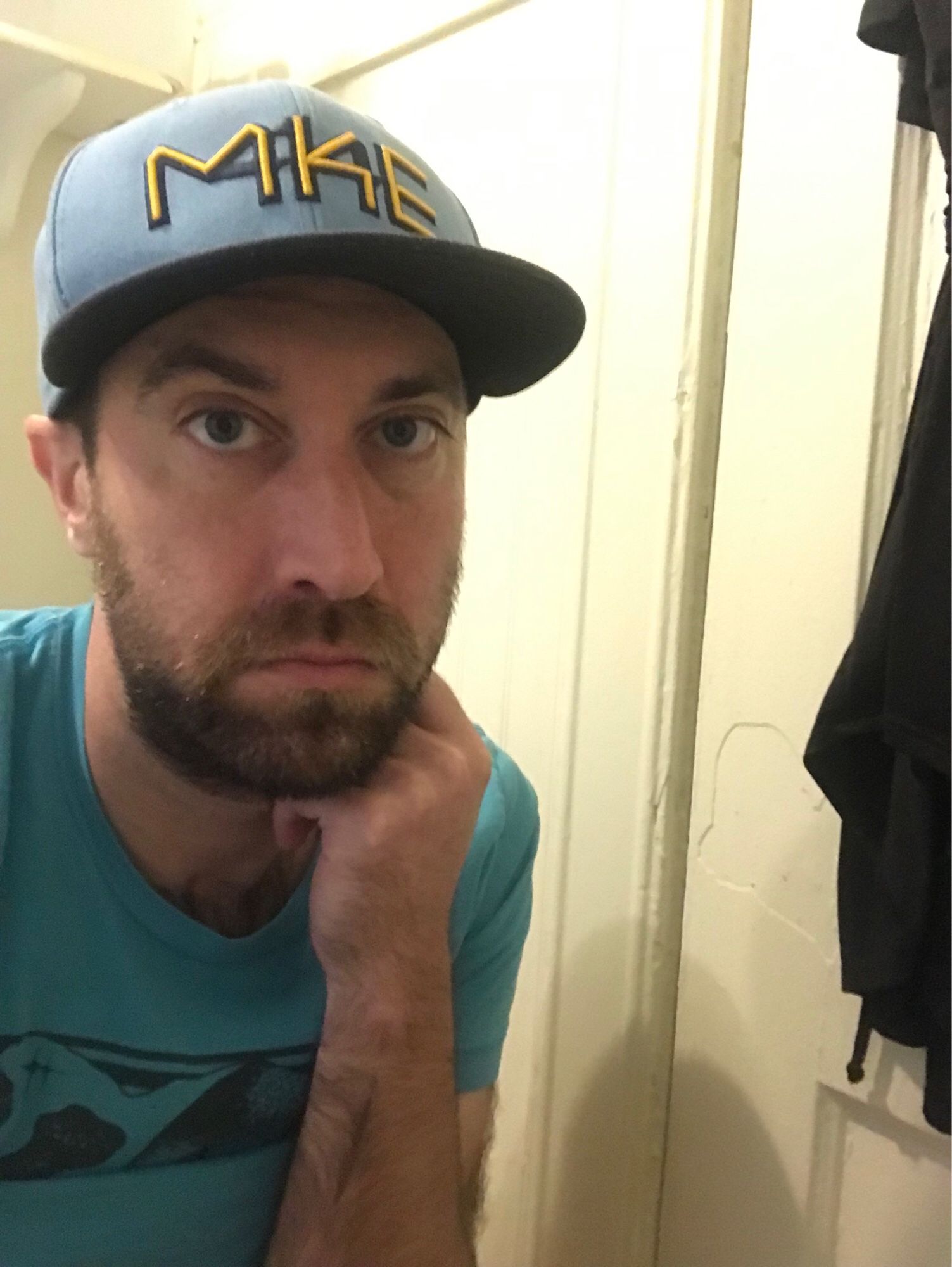 it’s me on the toilet, wearing a blue t shirt and blue mke brewers city connect hat. i may or may not be pooping