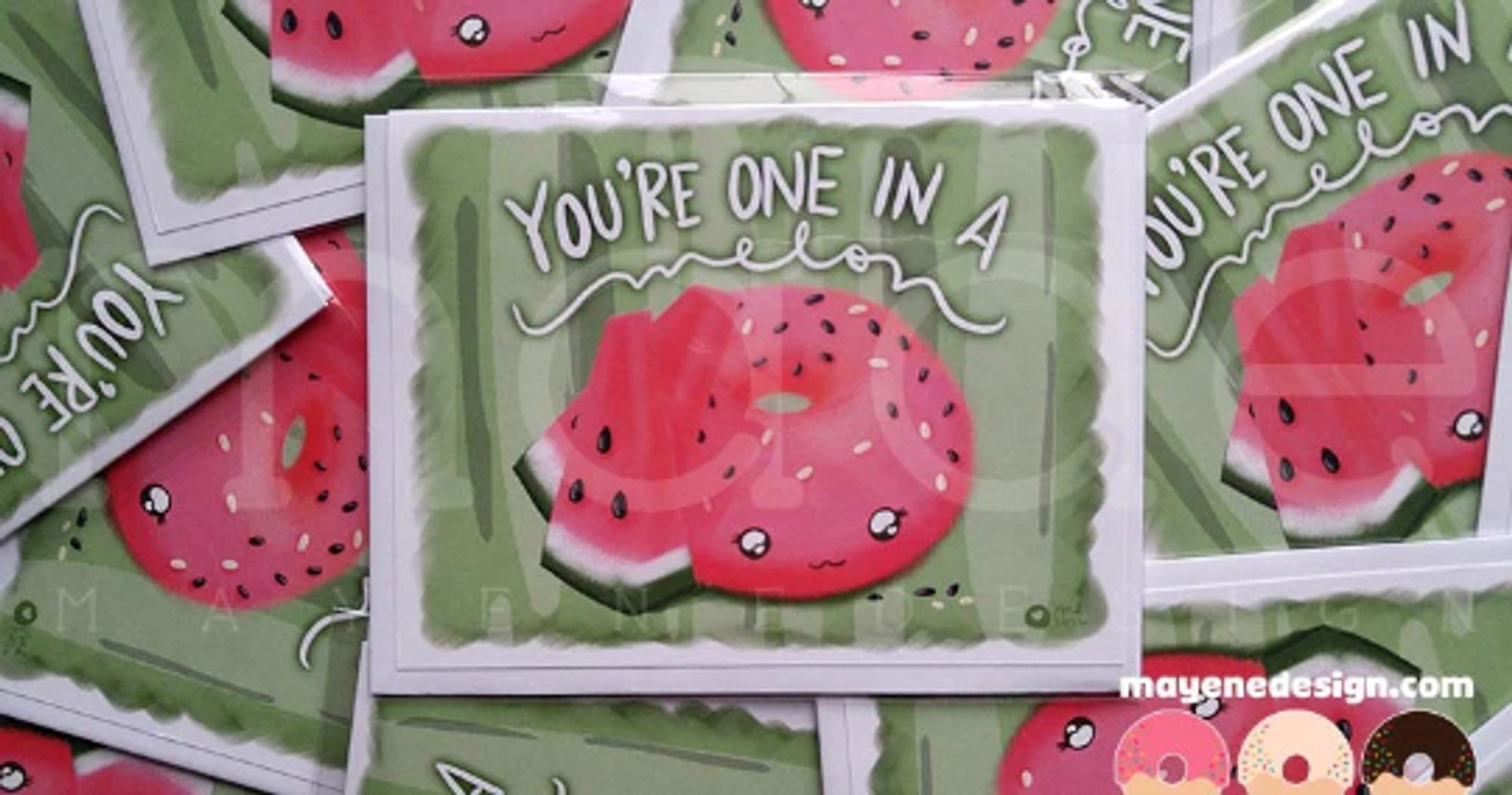 A green card showing an illustration of a pink donut with watermelon slices next to it and black and white sprinkles topping it. The card says: "You're one in a melon."